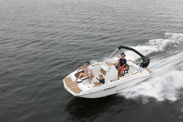 2025 Starcraft SVX 211 OB CC boat cruising on open water with passengers.