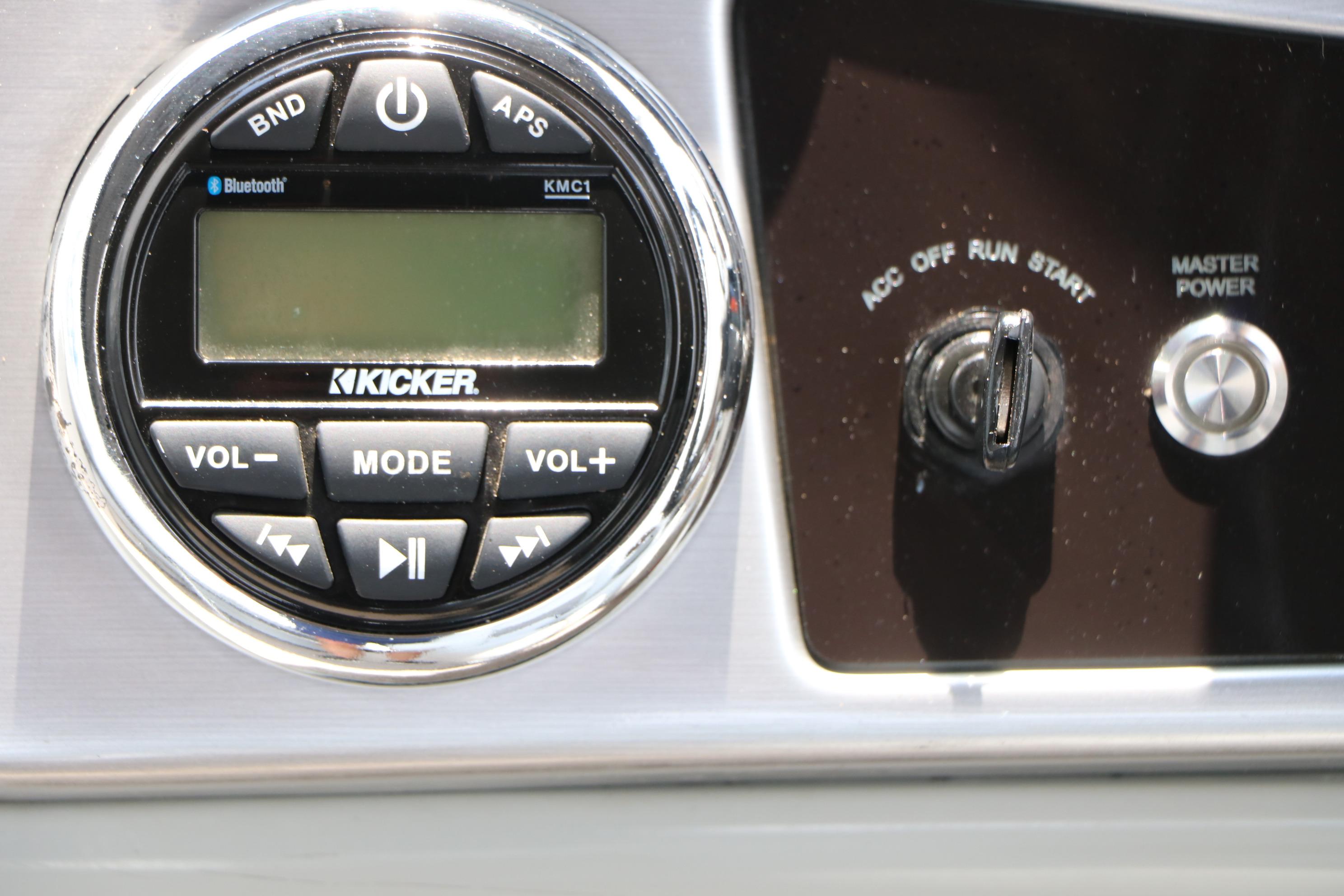 Kicker audio system and ignition switch on 2021 Ranger 223FC boat dashboard.
