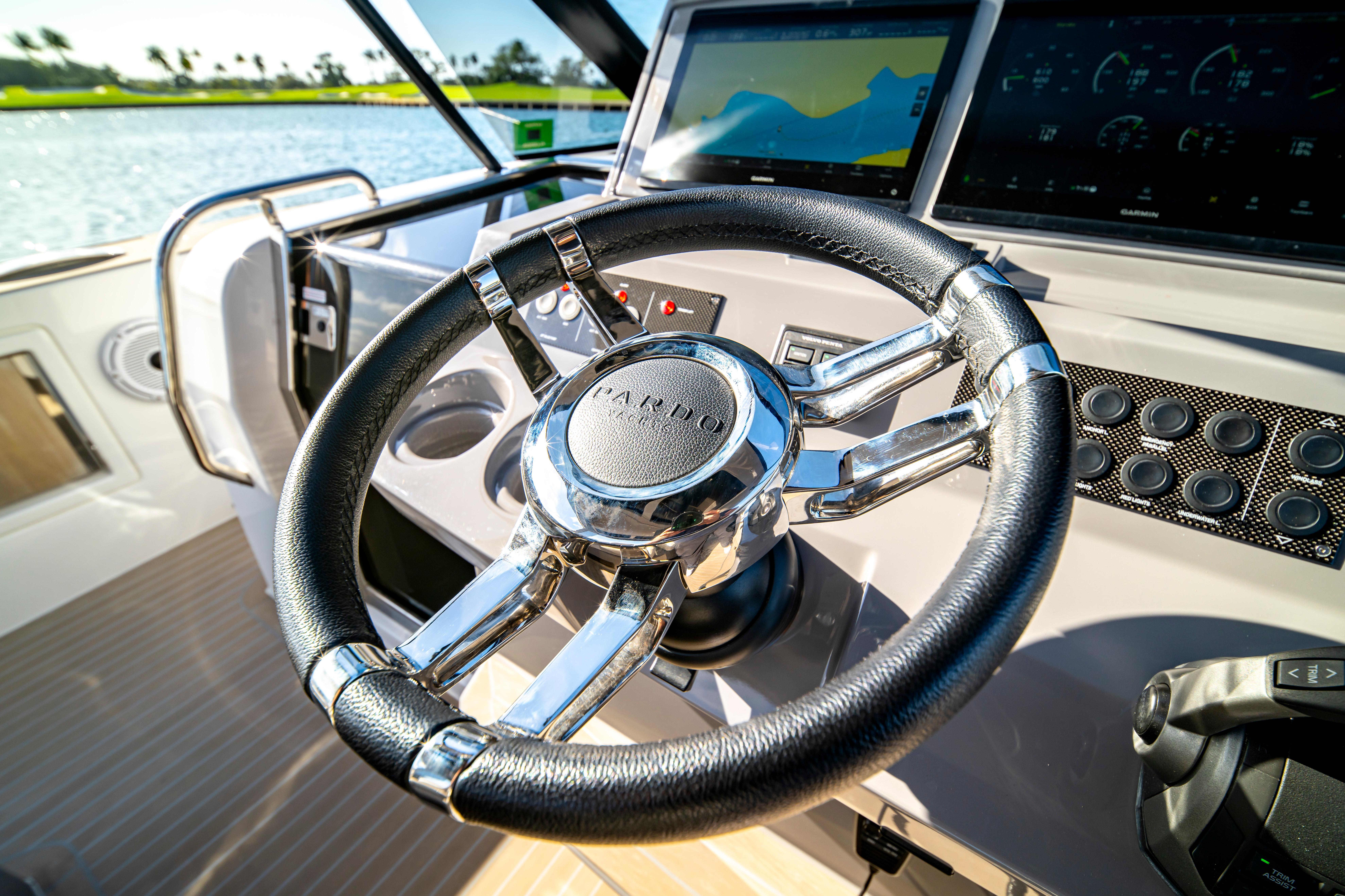Steering wheel and dashboard of 2024 Pardo Yachts P43, featuring modern controls and displays.