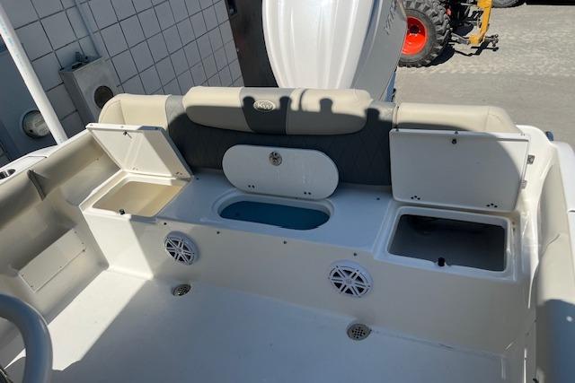 2026 Key West 239 FS boat interior with storage compartments and seating.