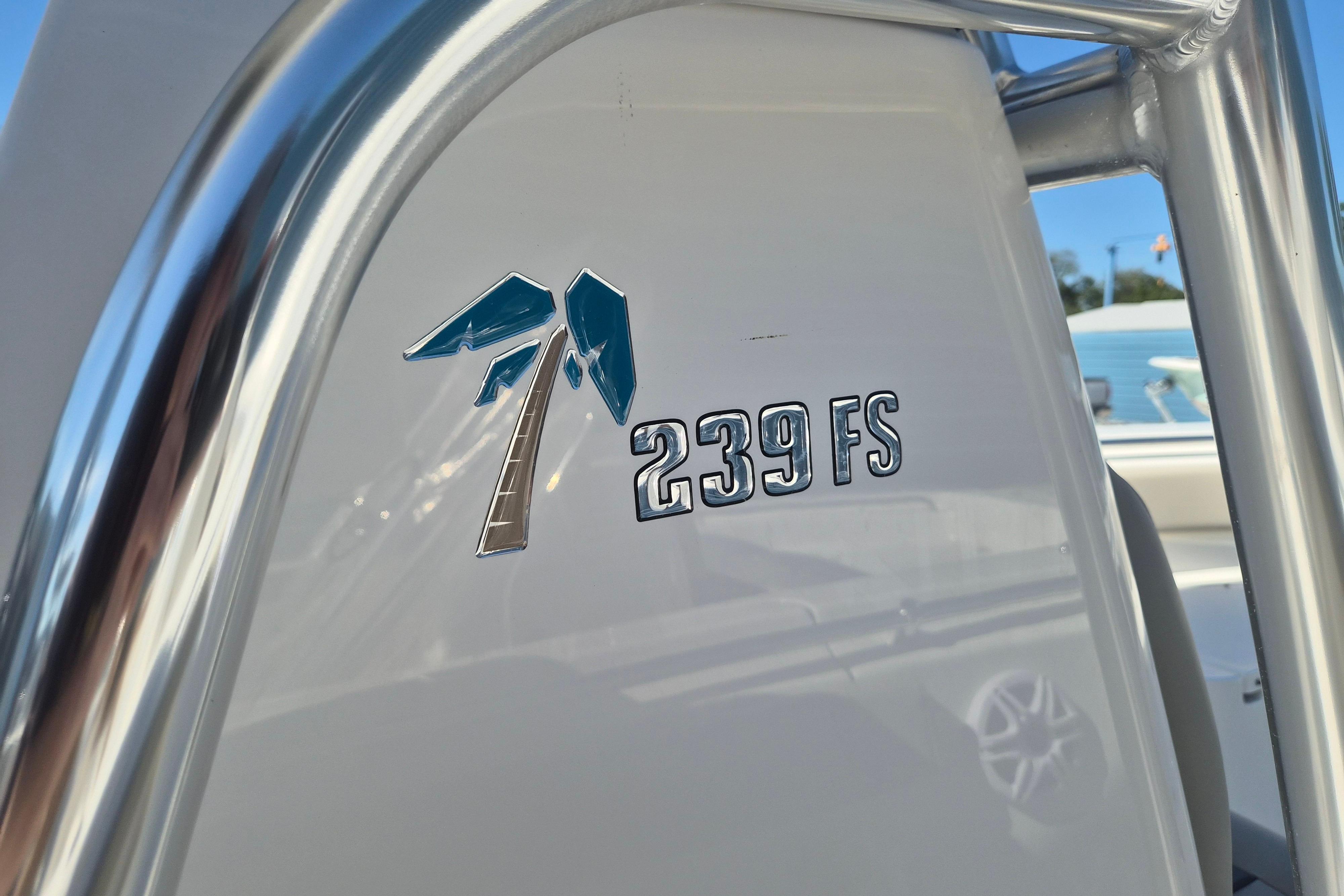 Close-up of 2026 Key West 239 FS boat logo on white surface.
