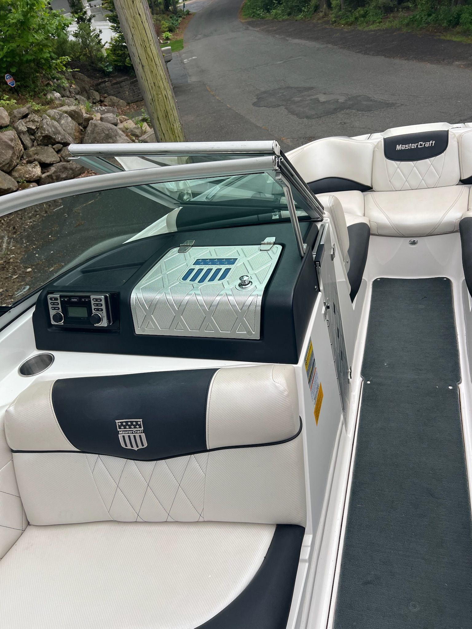 Interior view of a MasterCraft X-25 boat with white and black seating.