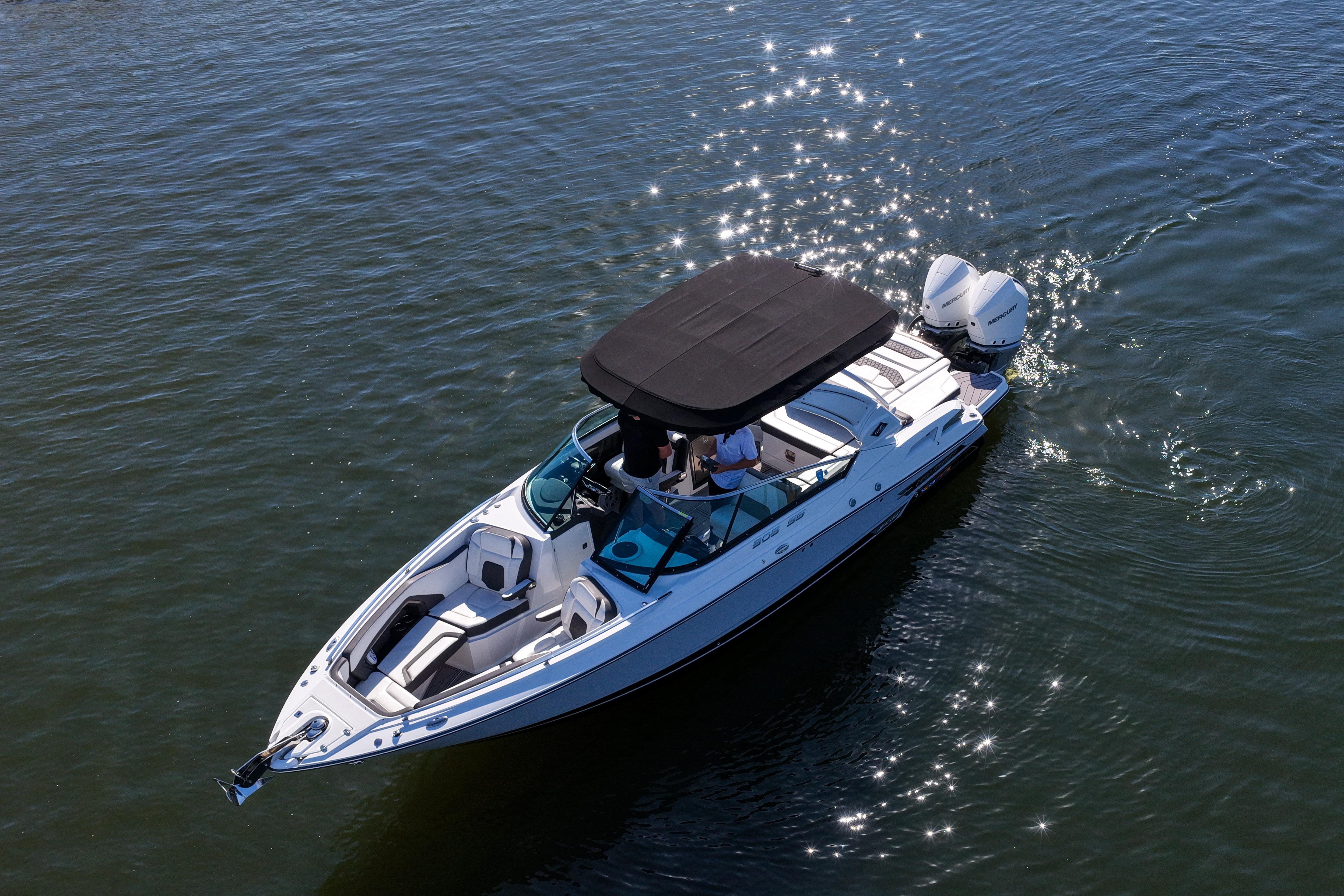 2023 Monterey 305SS Super Sport boat cruising on sparkling water.