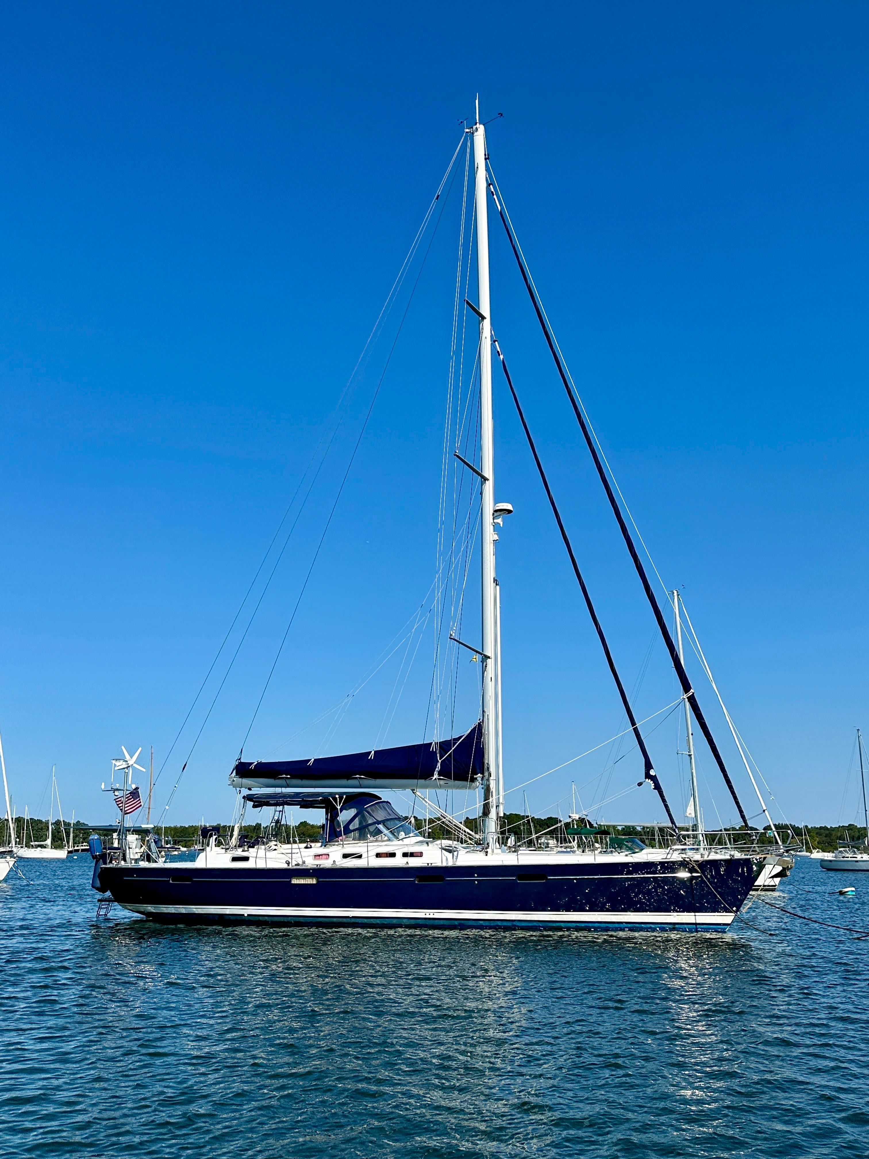 Sailing yacht Beneteau 57, 2010 model, anchored on a sunny day with clear blue skies.
