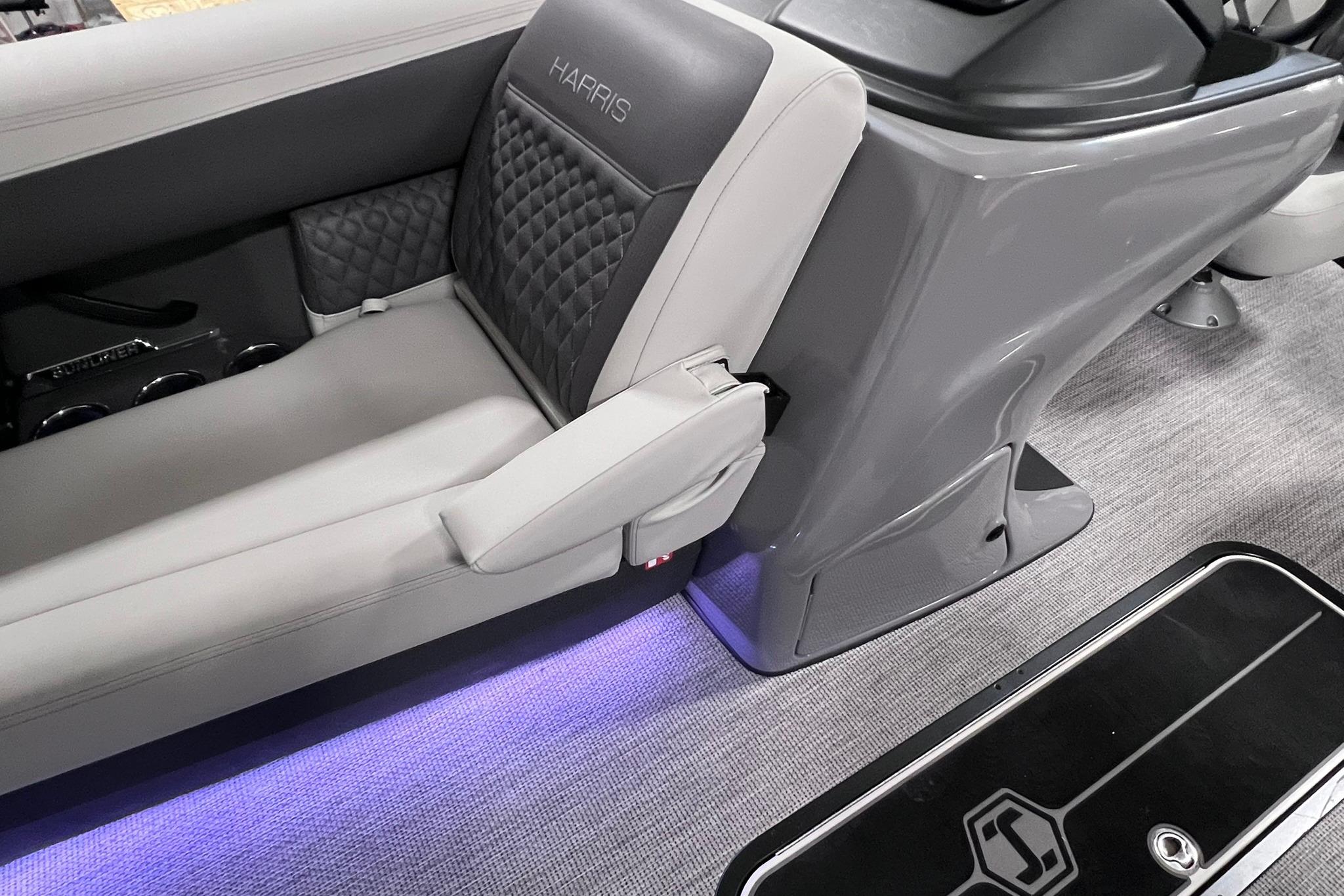 Luxurious interior of 2026 Harris Sunliner 250 SLE with elegant seating and ambient lighting.