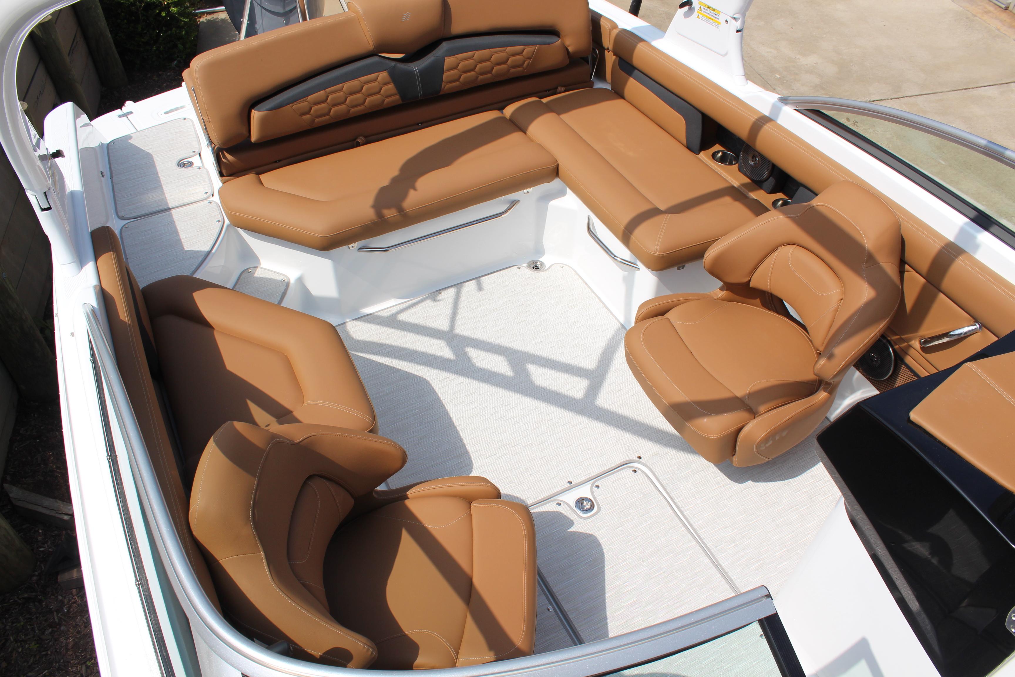 2025 Four Winns HD3 OB boat interior with luxurious tan seating and spacious layout.