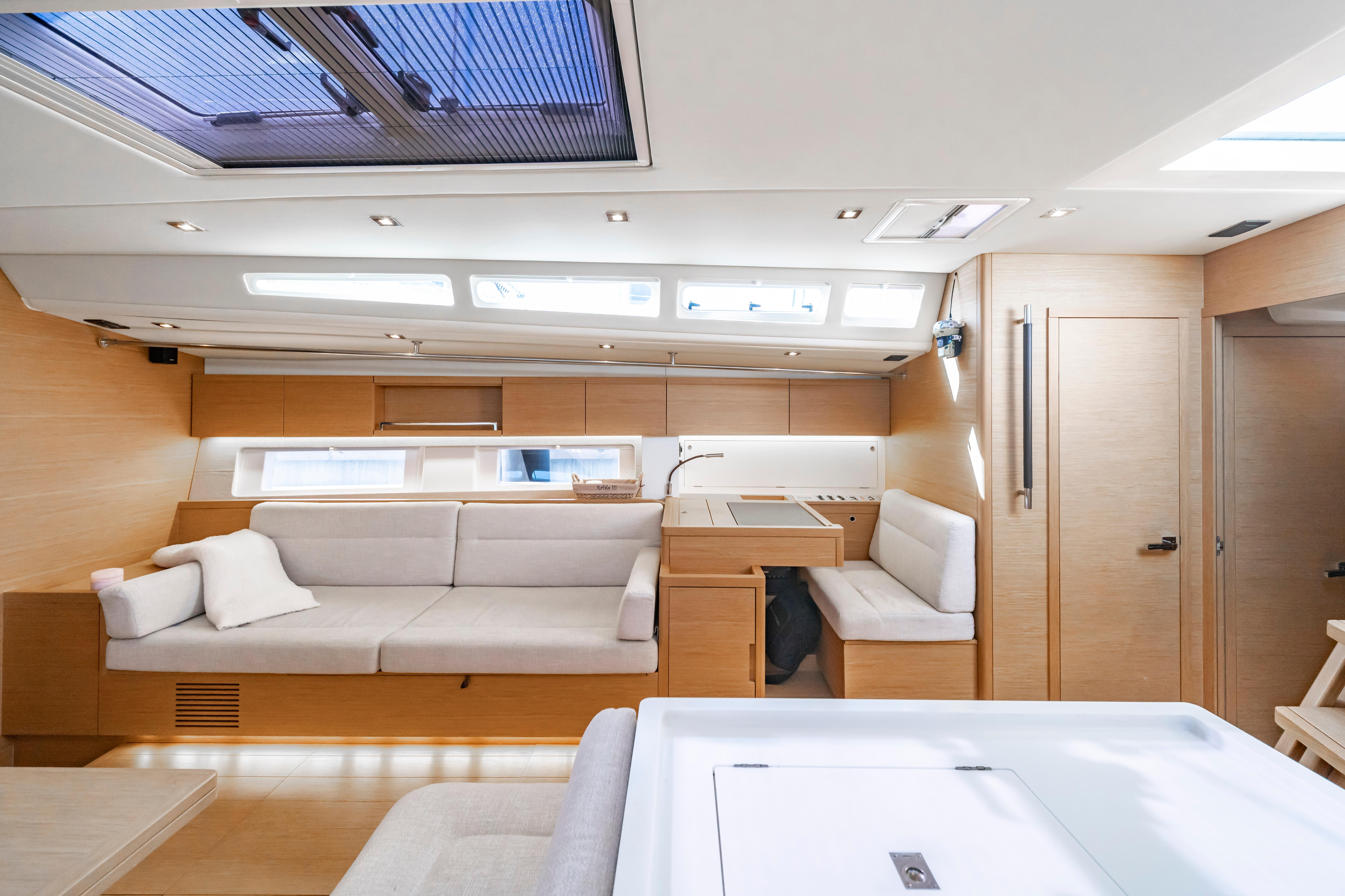 Luxurious interior of 2016 Grand Soleil 58 yacht with modern furnishings and ample natural light.