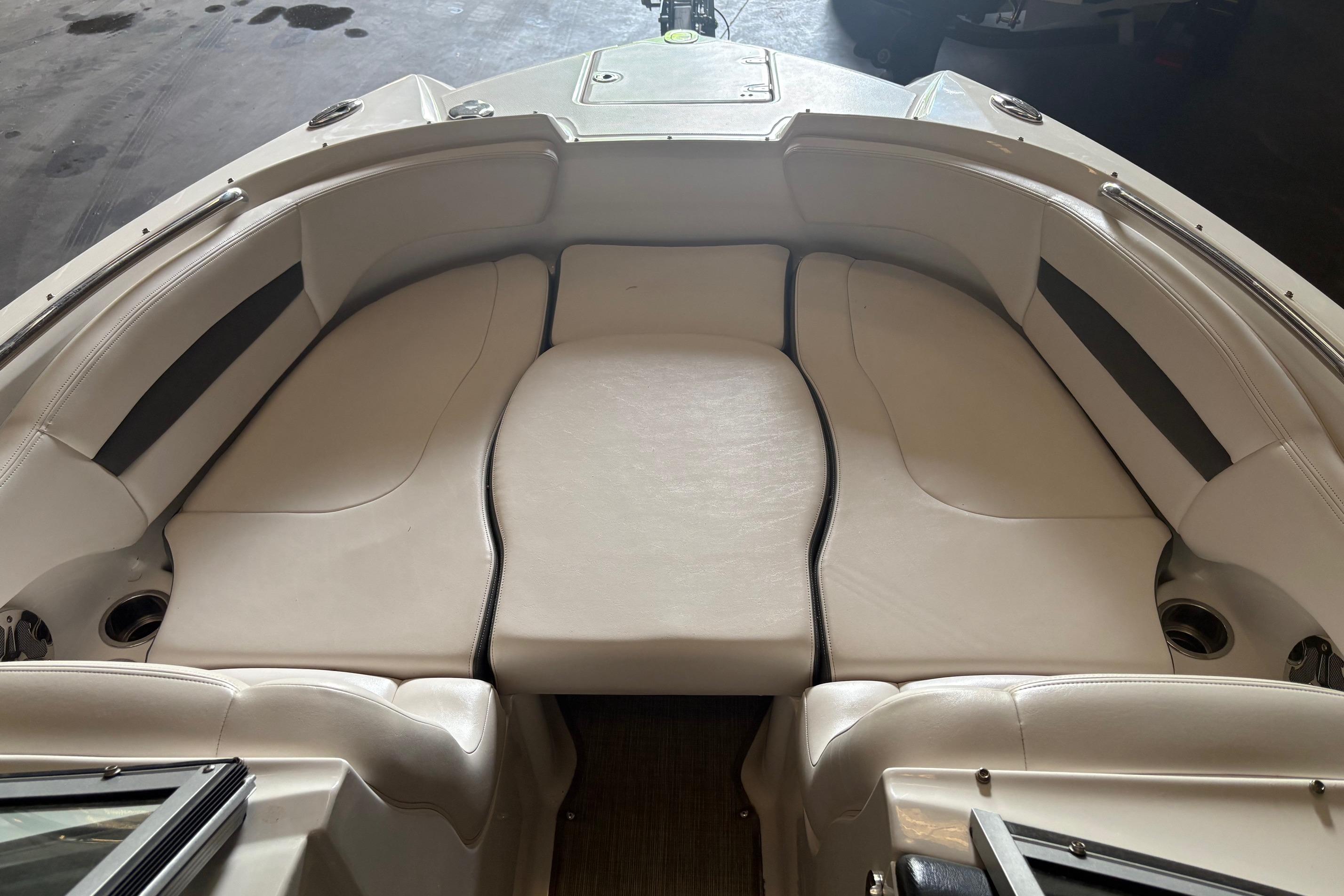 2016 Chaparral 244 Sunesta boat interior with white cushioned seating.