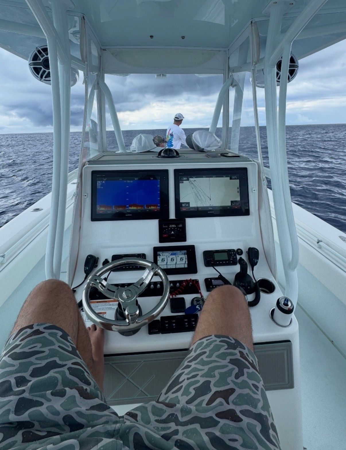 Helm of a 2019 Contender 35 ST boat on open sea.
