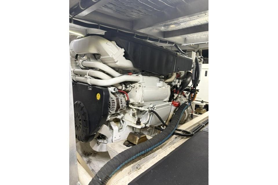 Engine room of a 2007 Navigator 5100 yacht, showcasing a powerful marine engine.