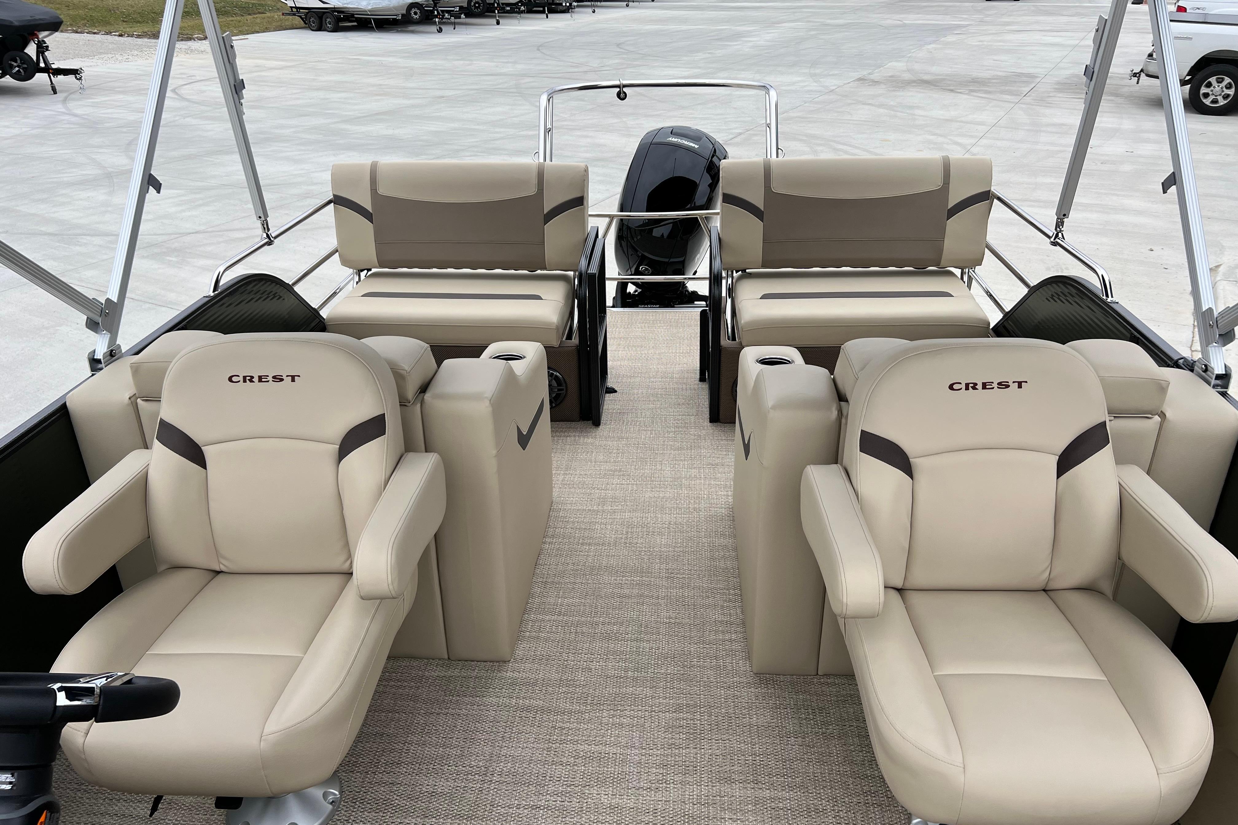 2024 Crest Classic LX 220 SLRC pontoon boat with luxurious beige seating.