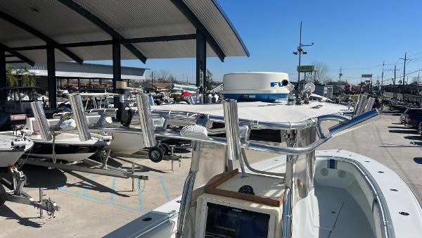 2005 Contender 36 Open boat in a marina, surrounded by other boats.