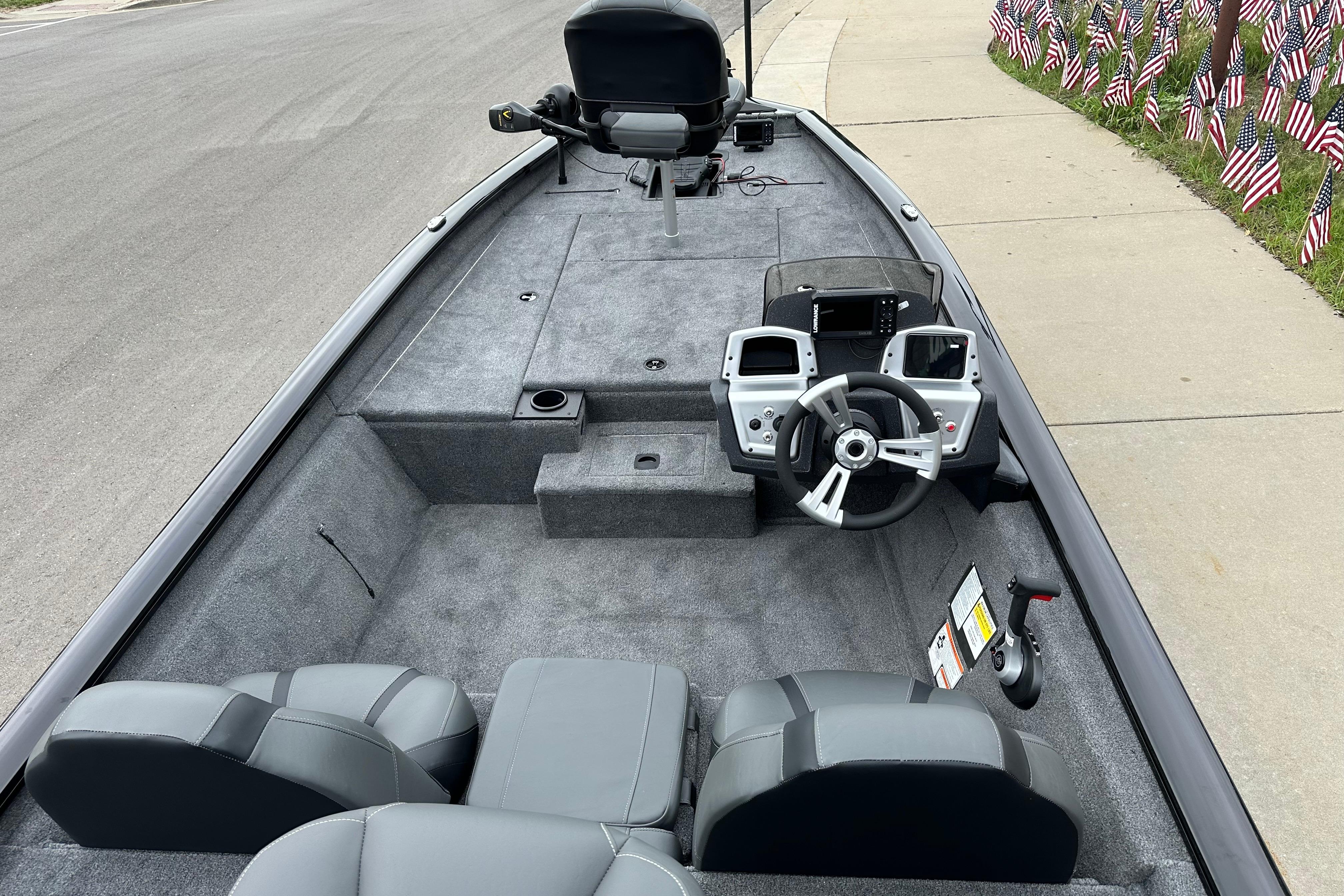 2026 Tracker Pro Team 190 boat interior with steering console and seating.