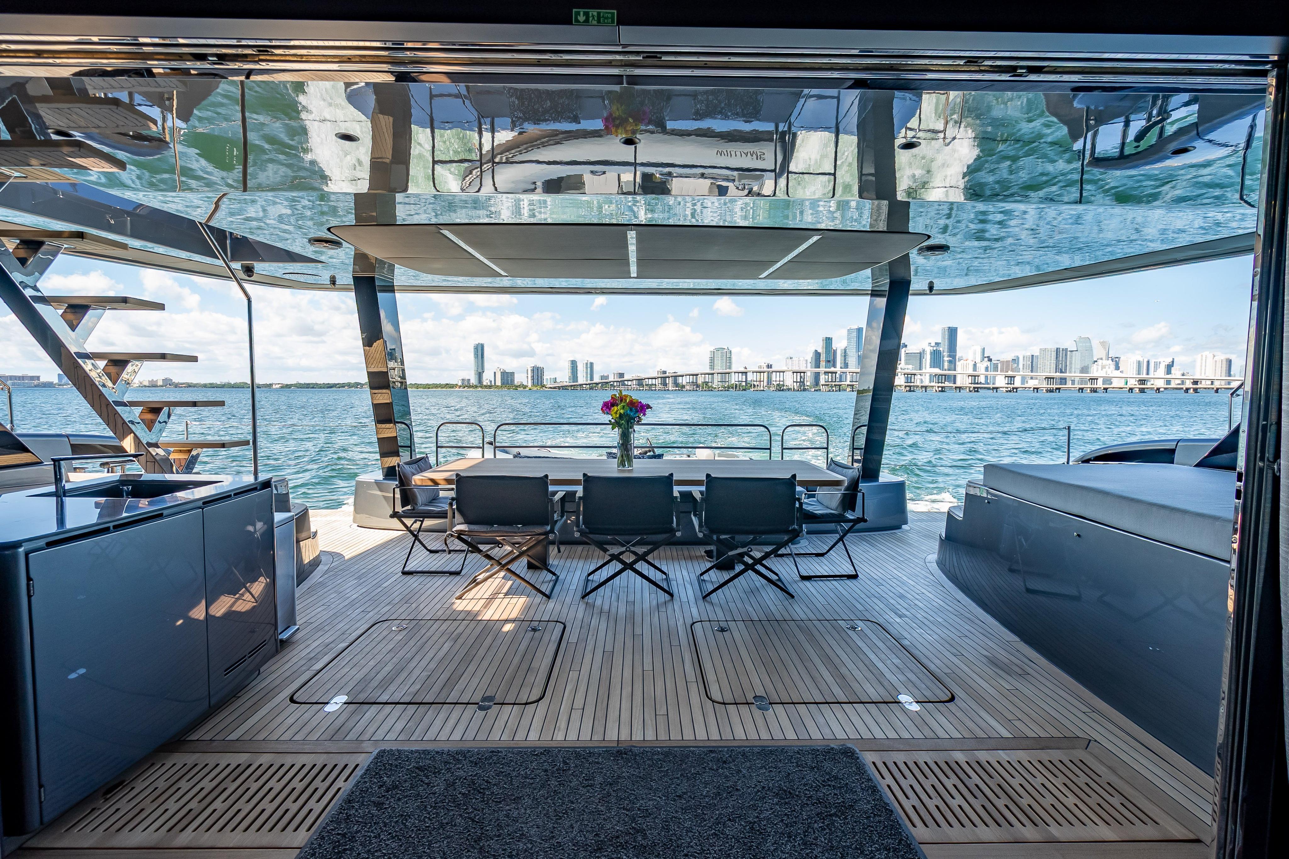 Luxurious Sunreef 60 Power yacht interior with ocean view, featuring modern seating and elegant design.