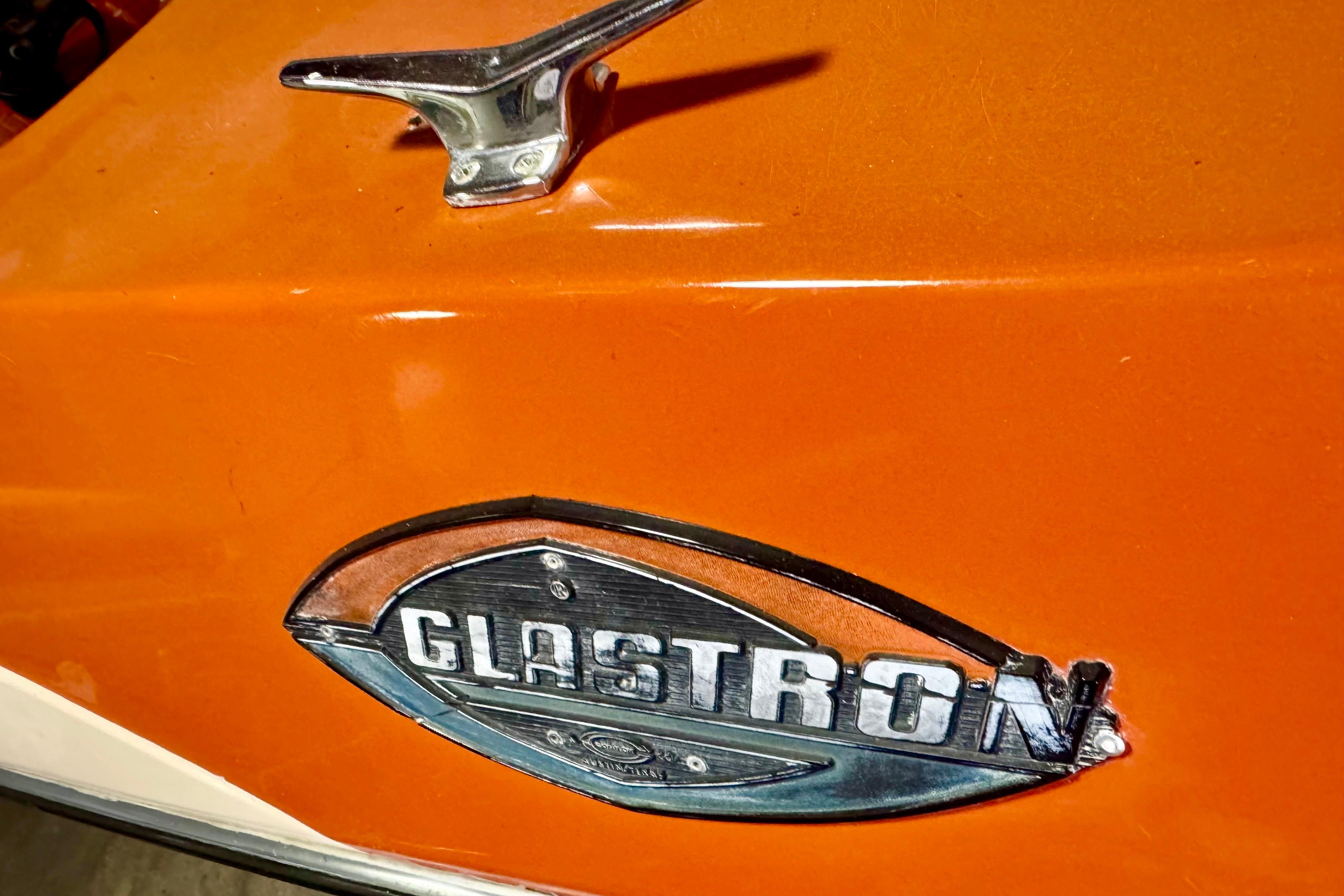 1971 Glastron/Carlson GT 15 boat emblem on vibrant orange surface.