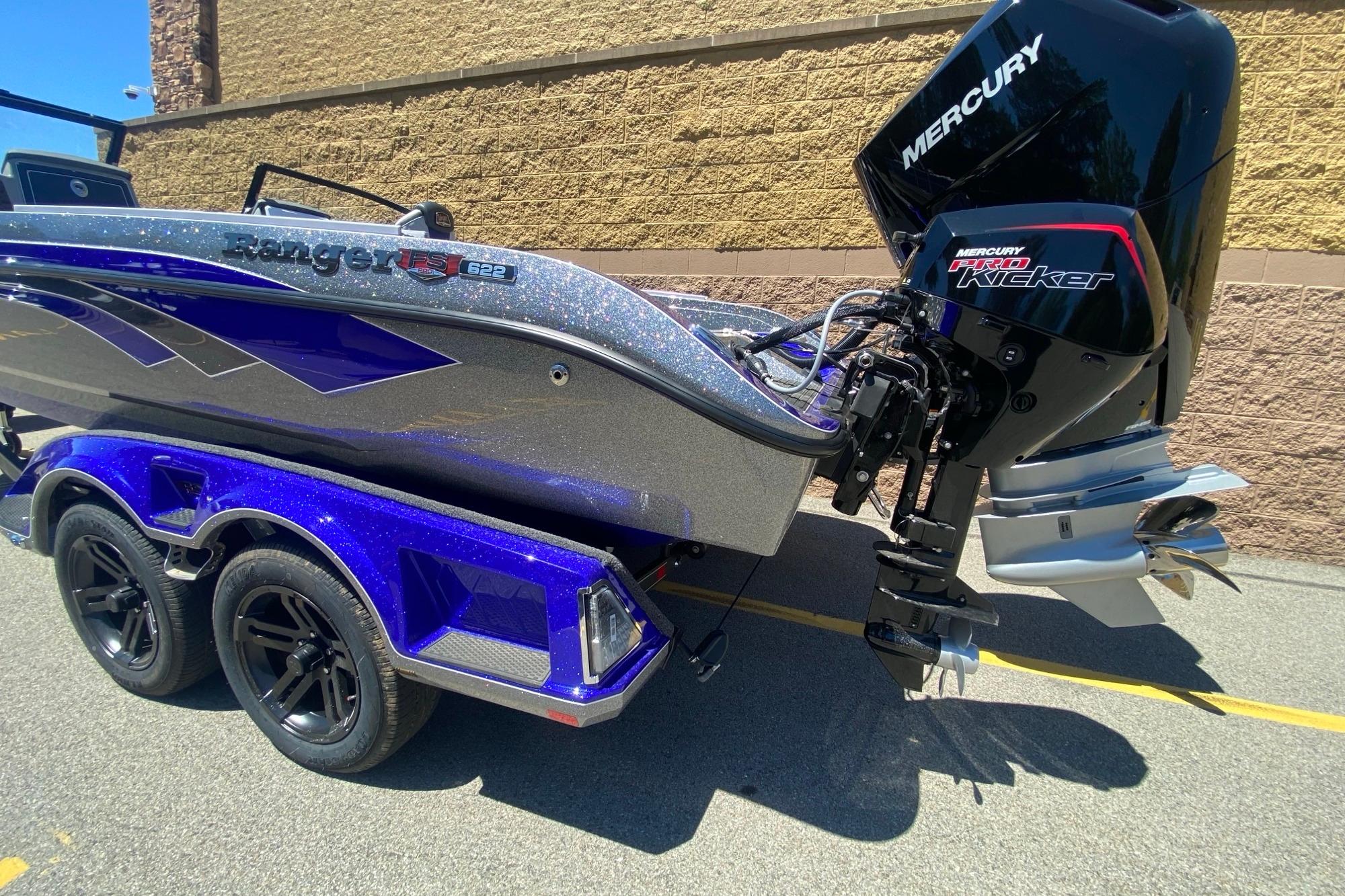 2026 Ranger 622FS Pro boat with Mercury Pro Kicker engine, parked on a trailer.
