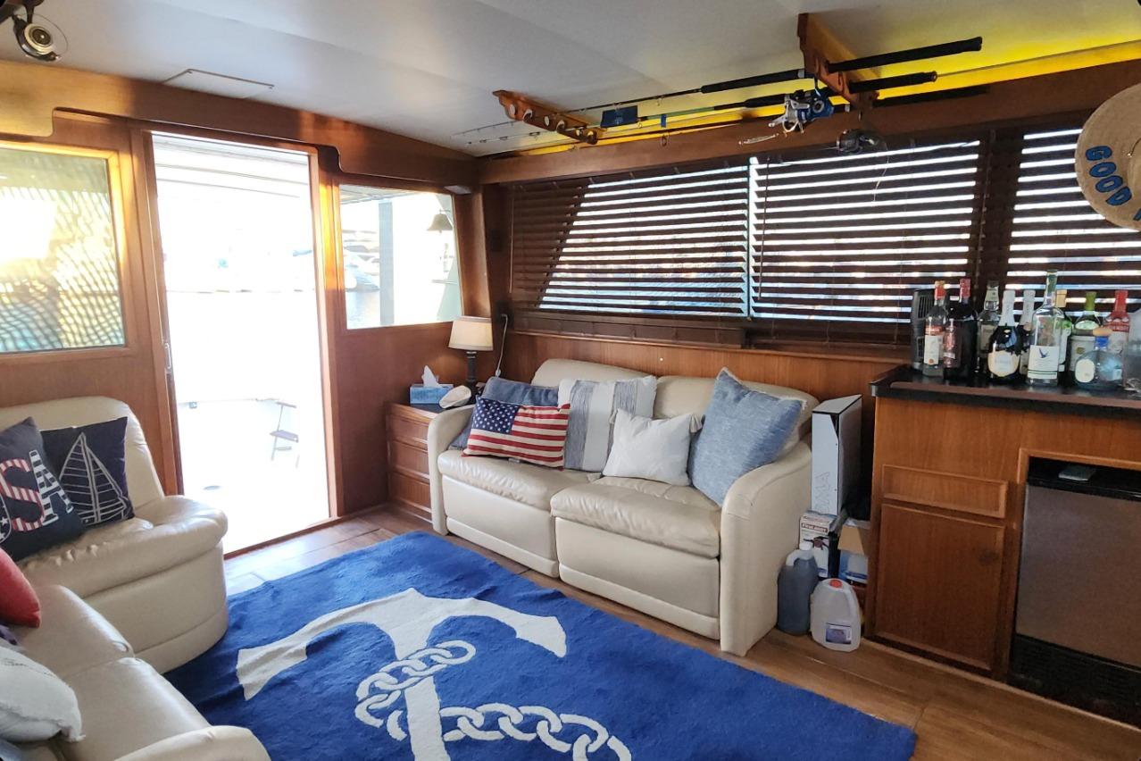Interior of 1978 Hatteras 45 Express Sportfish with nautical decor and bar setup.