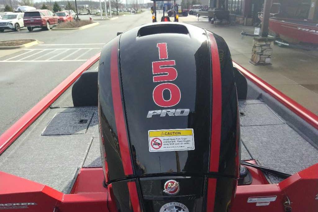 2026 Tracker Pro Team 195 boat with a 150 Pro engine, parked outdoors.