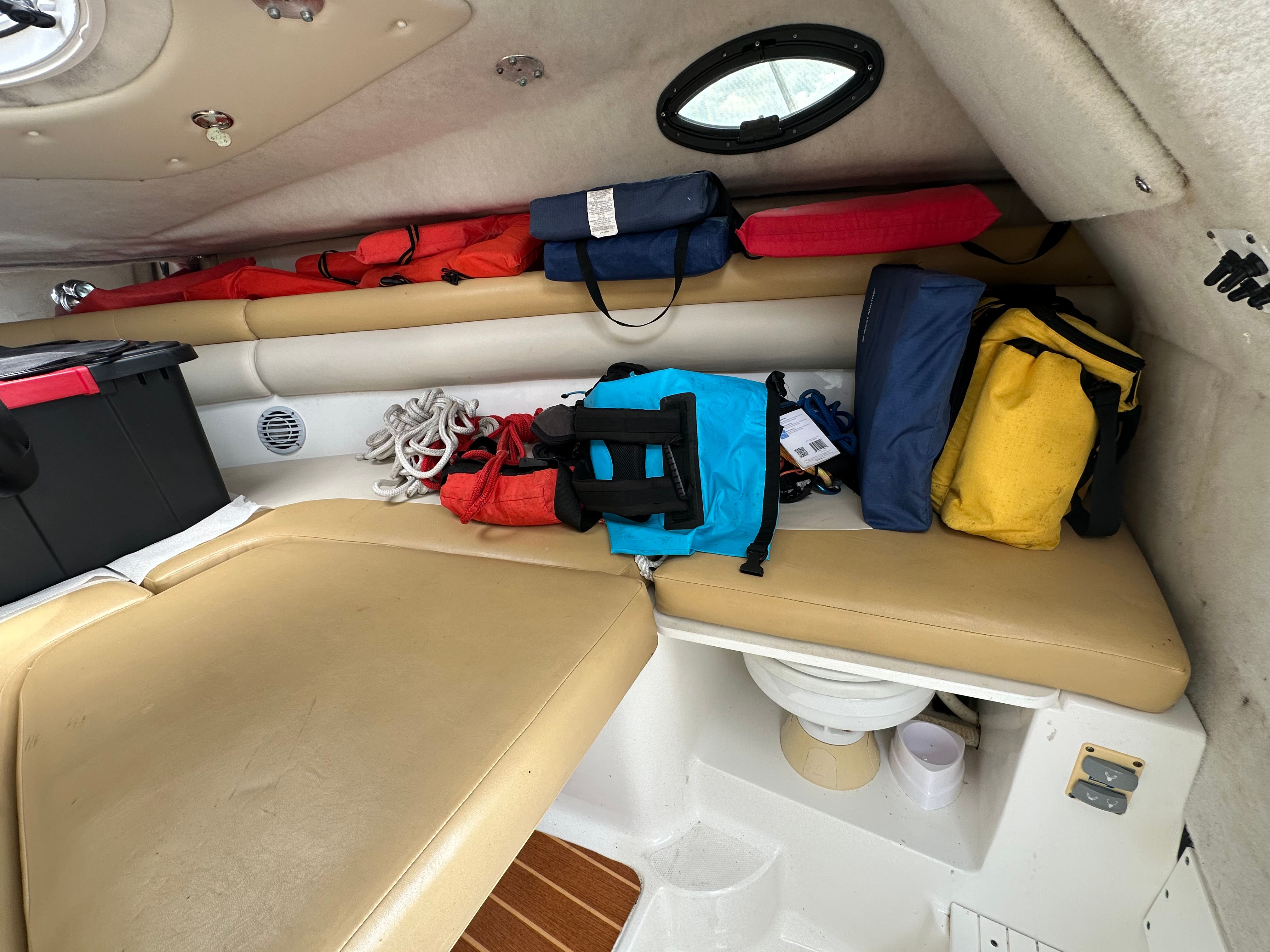 Interior of a 2009 Sea Fox 256WA with seating and storage.
