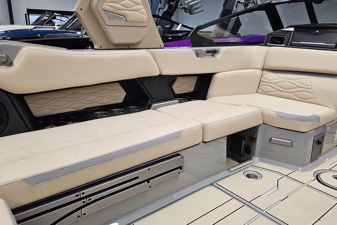 Luxurious interior of a 2026 Supra SL boat with beige leather seating.
