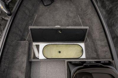 2026 Alumacraft Escape 165 CS boat interior with open storage compartment.