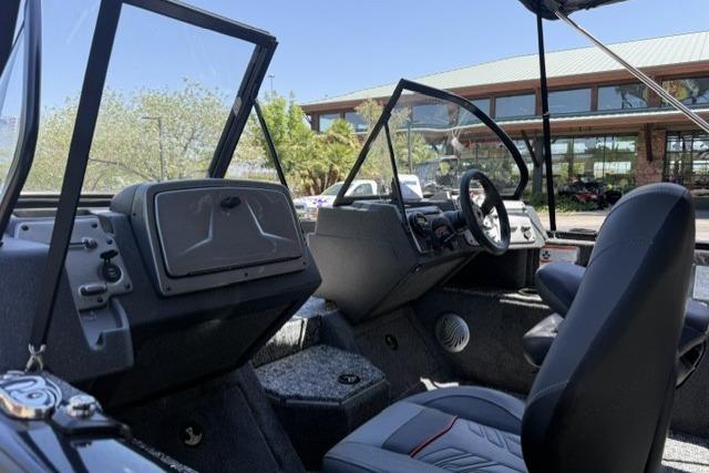 Interior view of 2026 Tracker Pro Guide V-175 WT boat, showcasing seating and dashboard.