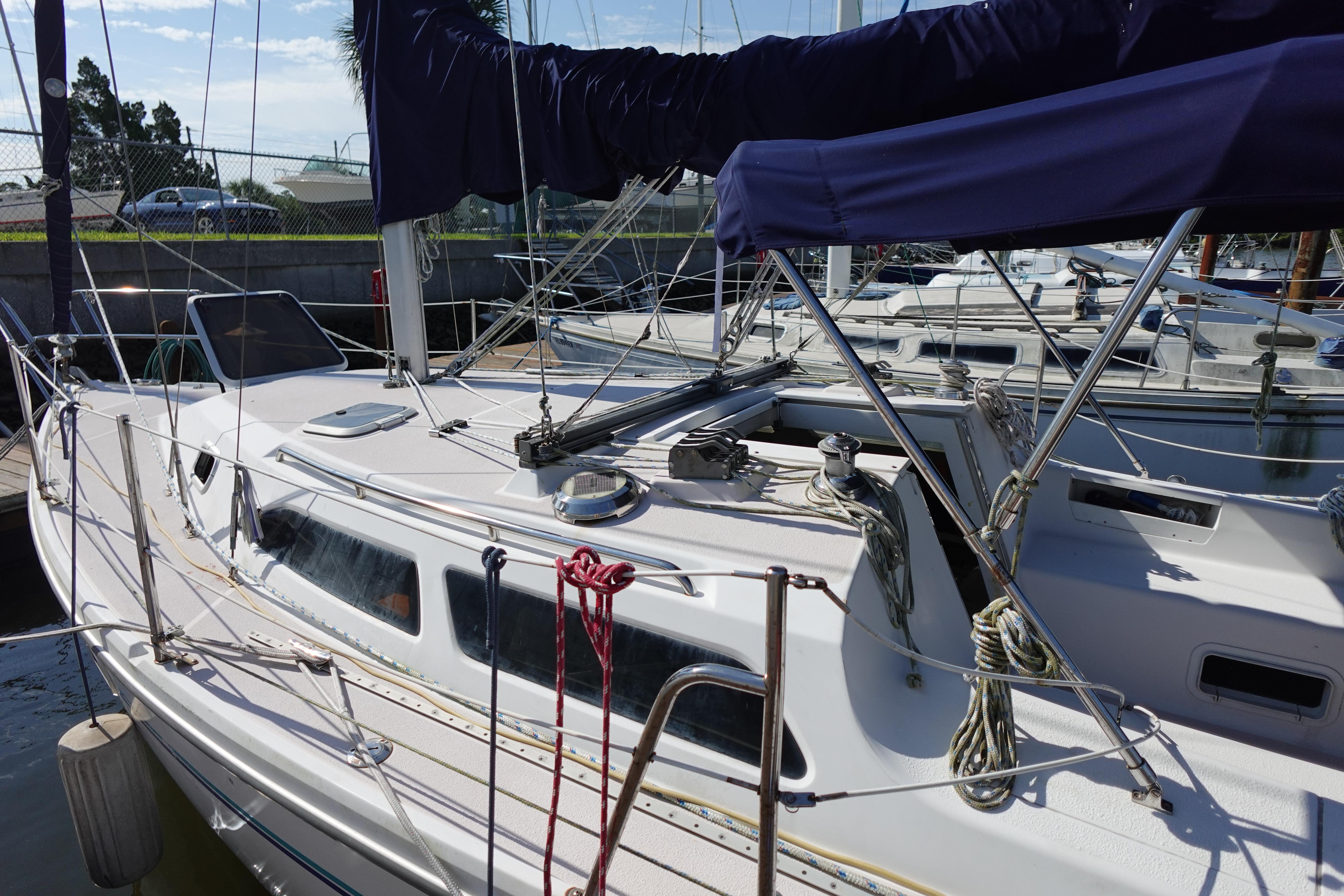 1997 Catalina 28 sailboat docked, featuring a sleek design and well-maintained deck.
