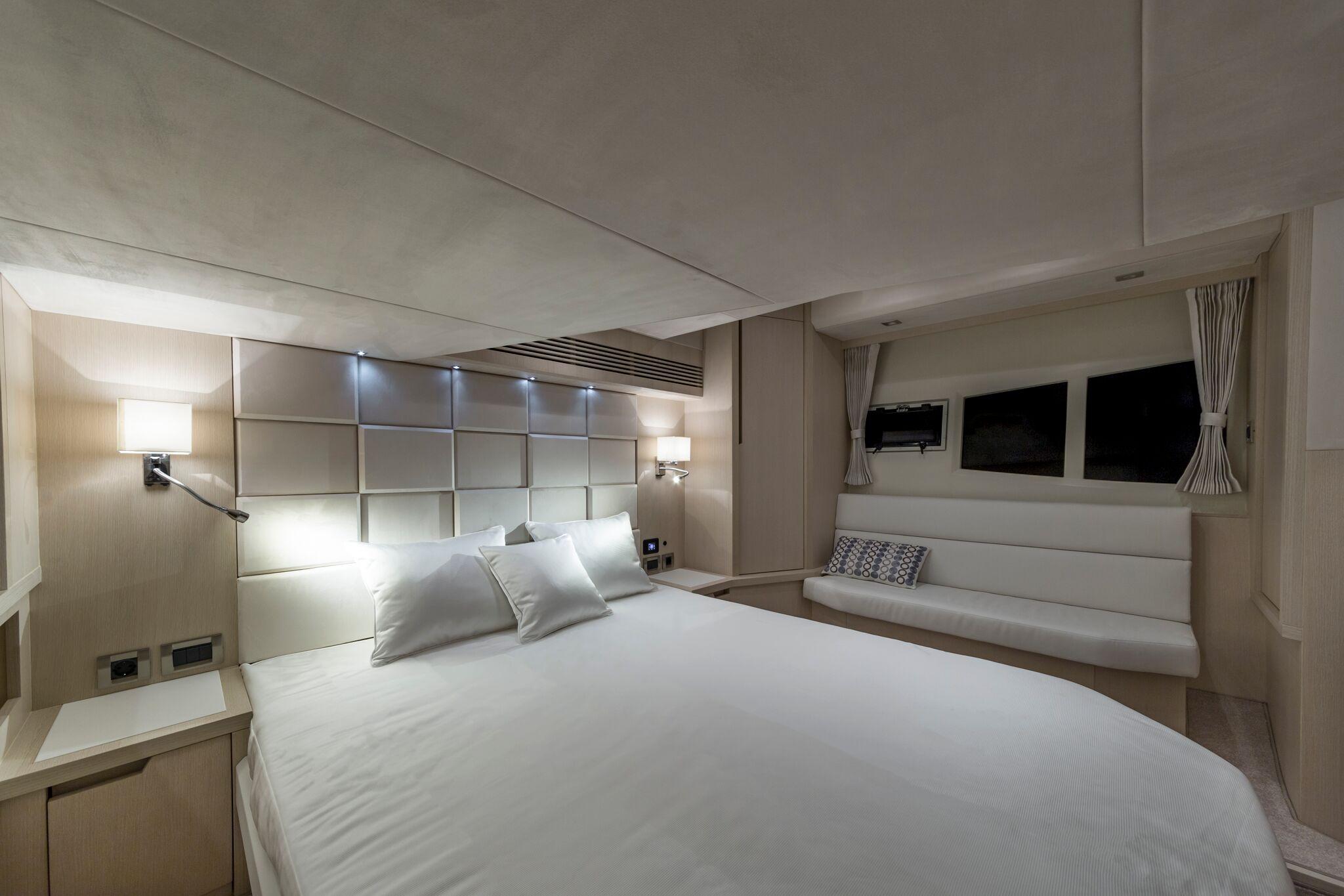 Luxurious bedroom interior of 2025 Galeon 485 HTS yacht with modern design.