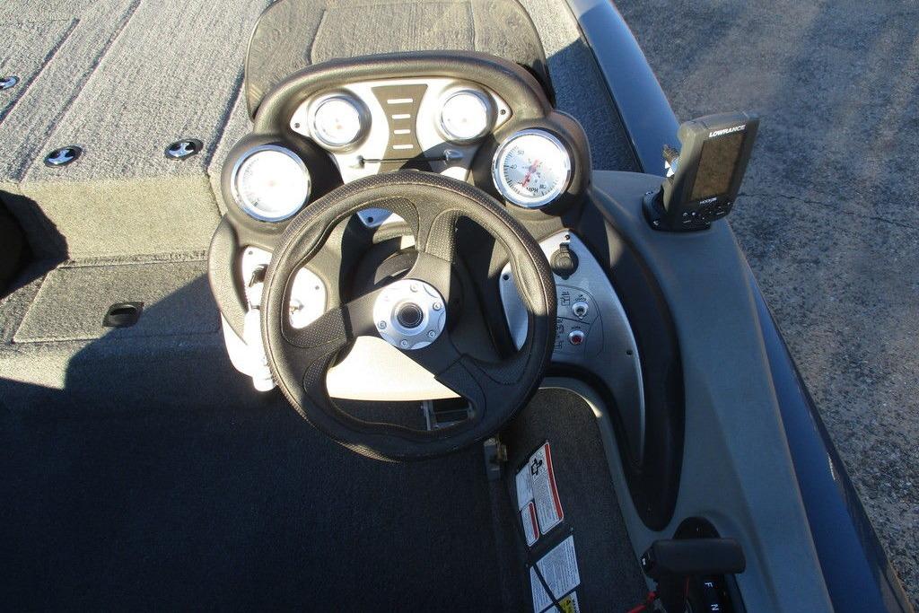 2017 Tracker Pro Team 195 TXW boat dashboard with steering wheel and gauges.