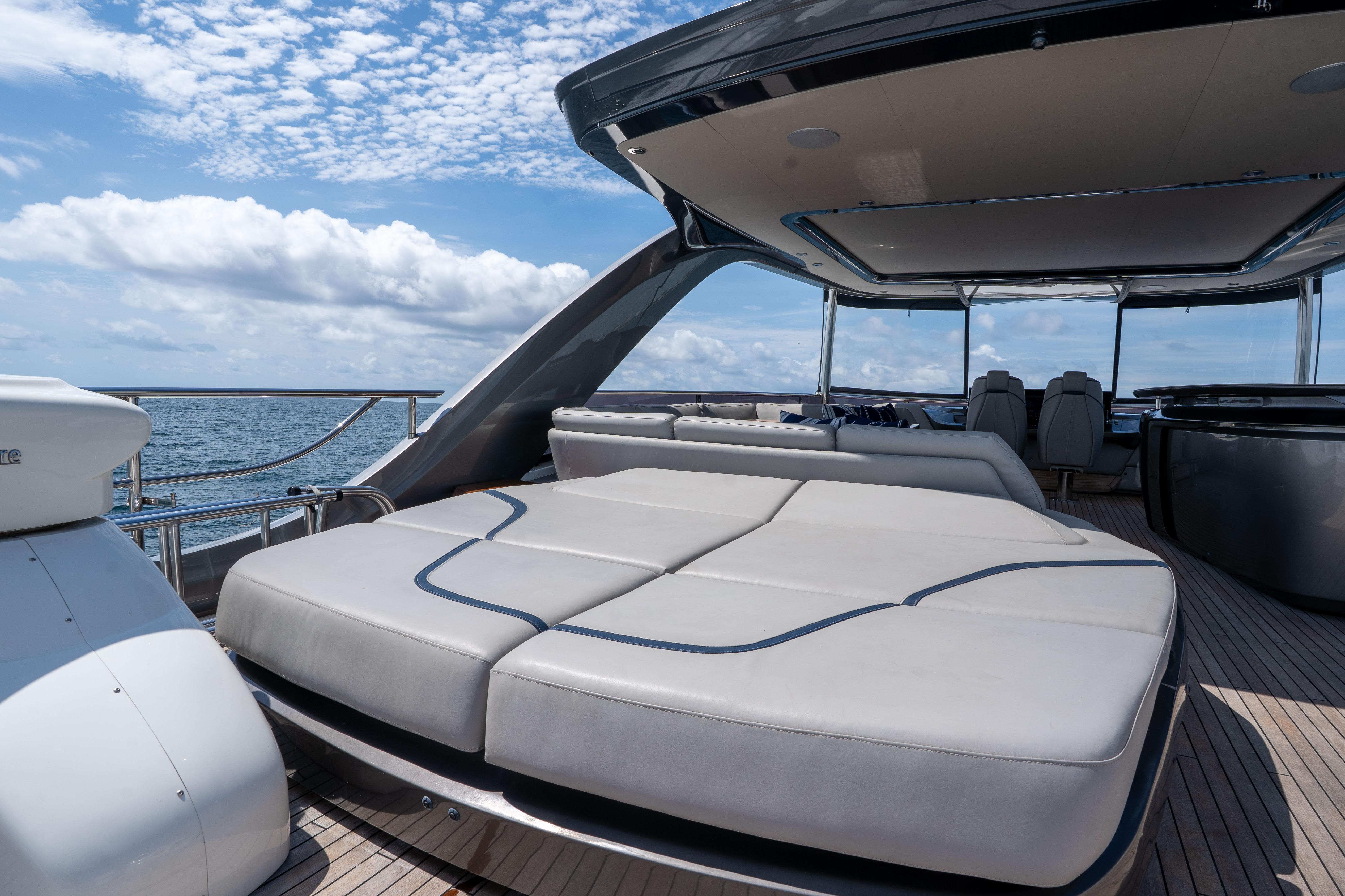Luxurious 2020 Princess Y85 yacht deck with spacious seating under a clear blue sky.