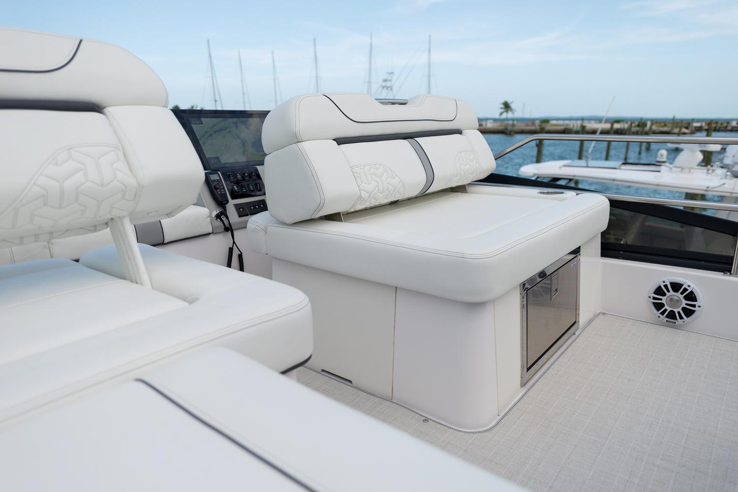 Manufacturer Provided Image: Luxurious seating on 2025 Regal 38 FXO yacht, featuring sleek white upholstery and modern design.