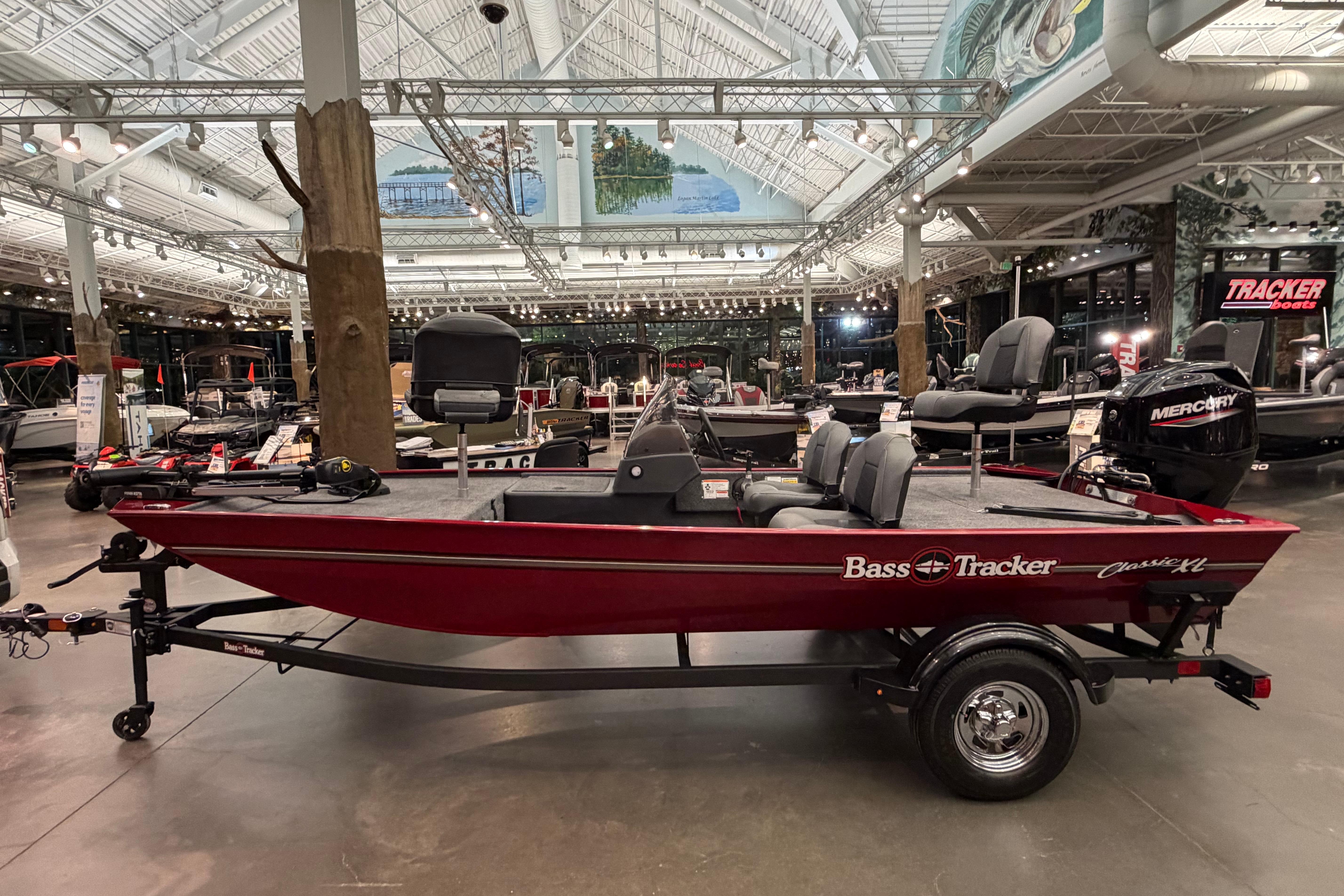 2026 Tracker Bass Tracker Classic XL boat displayed in a showroom with modern lighting.