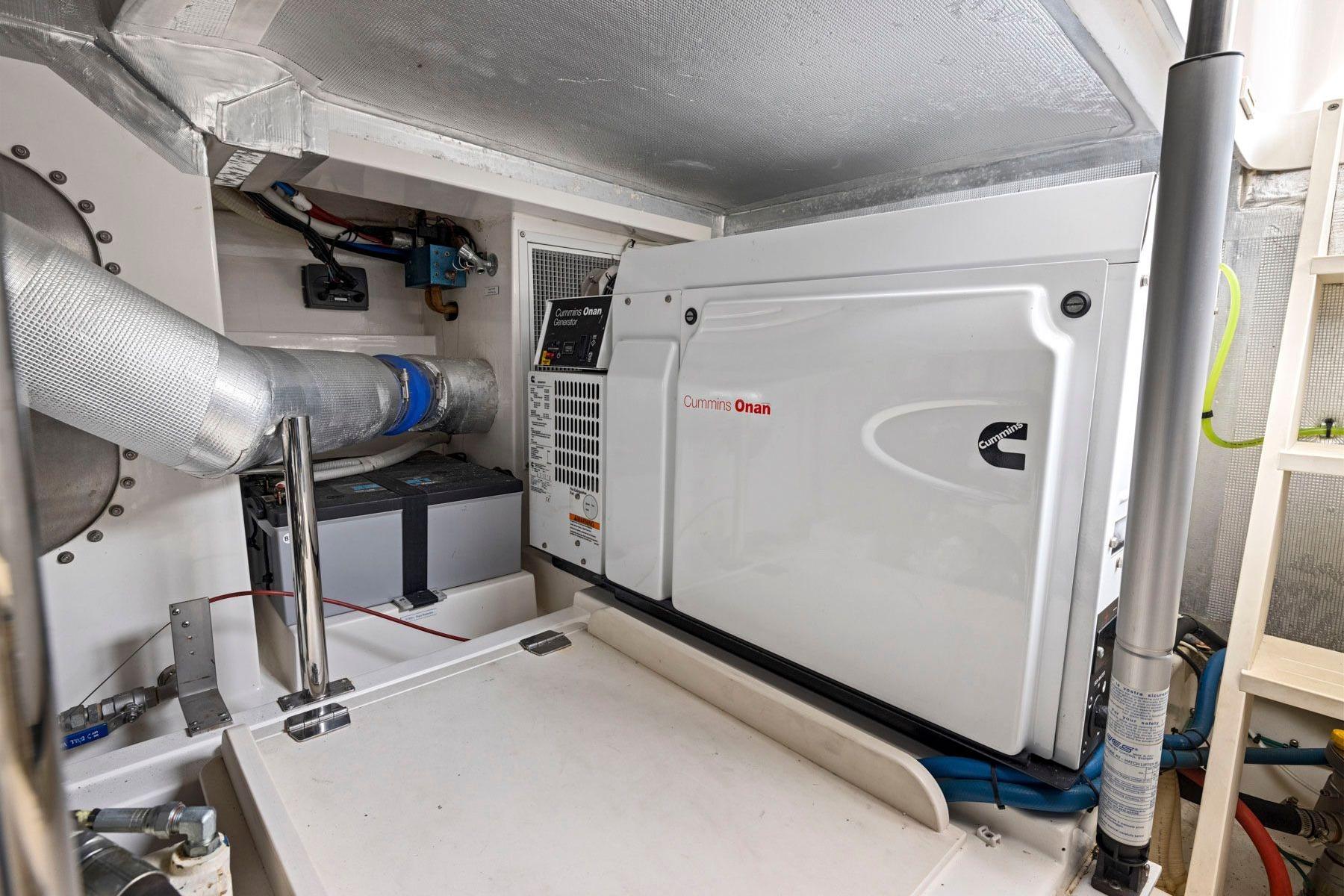 Engine room of 2014 Maritimo M50 yacht with Cummins Onan generator.