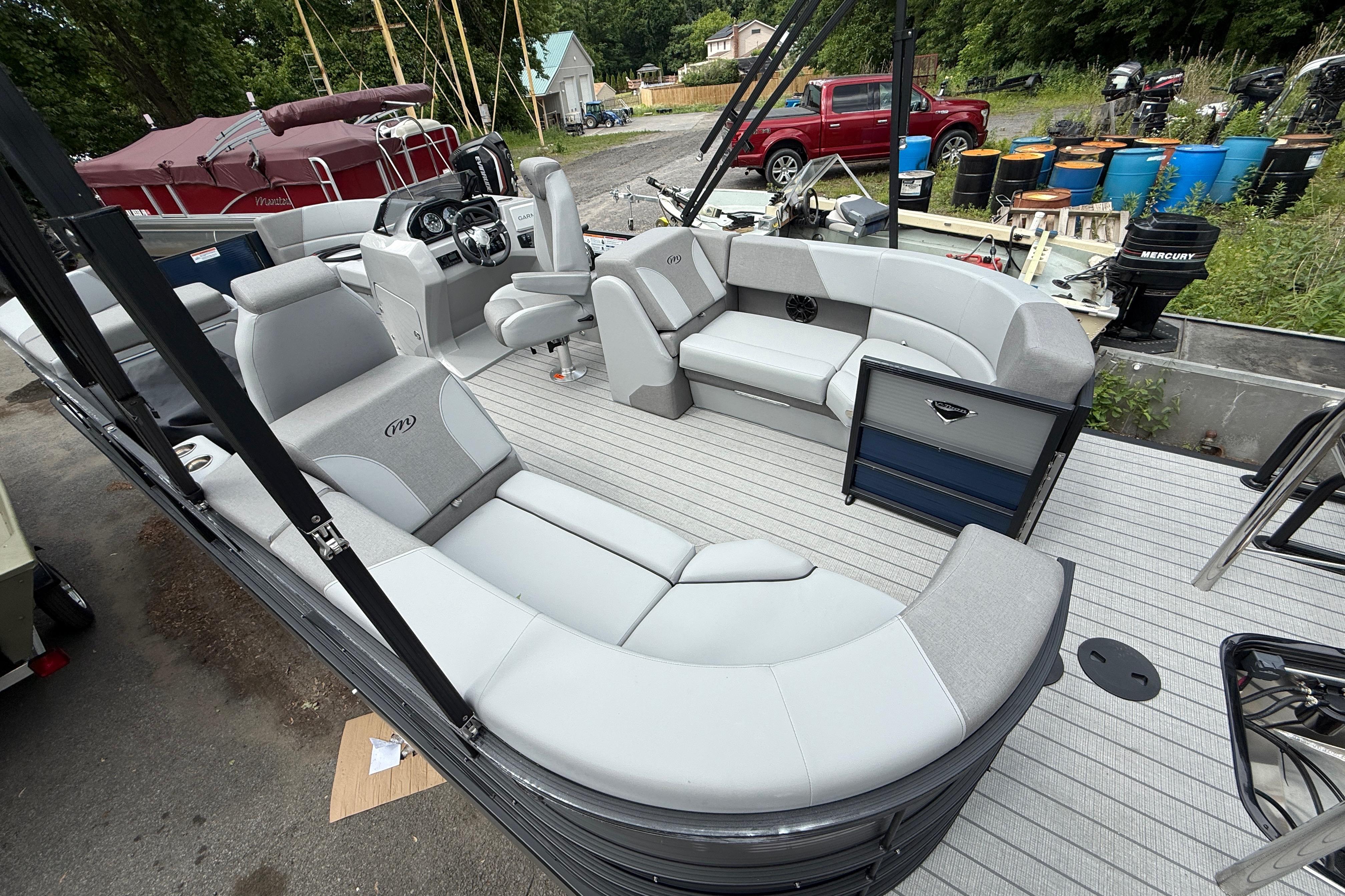 2027 Manitou Aurora RF 23 pontoon boat with spacious seating and modern design.