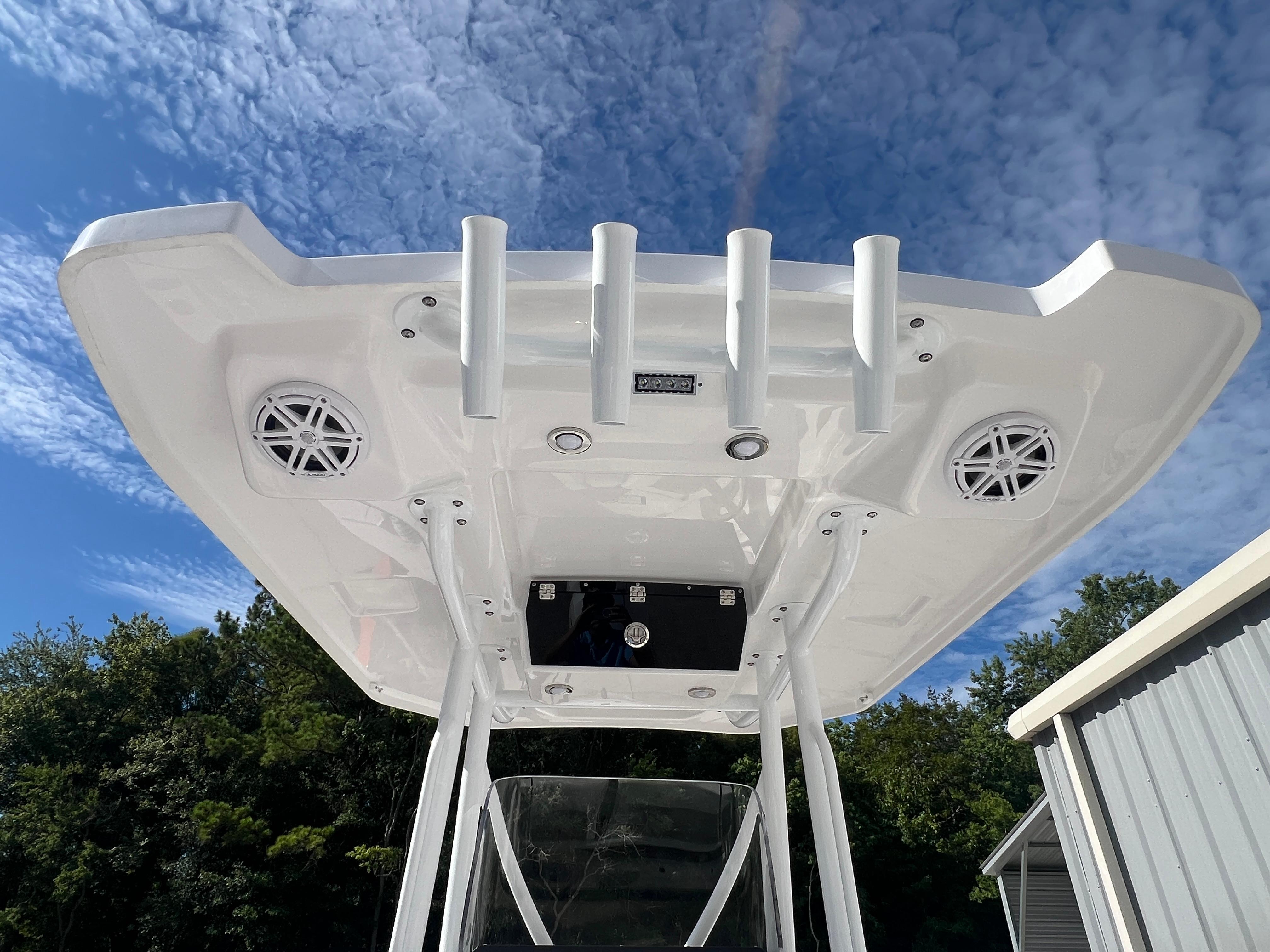 2025 Blackfin 222 CC boat T-top with rod holders and speakers.