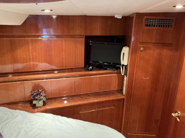 Luxurious cabin interior of 2000 Novatec Islander 55 yacht with wood paneling.