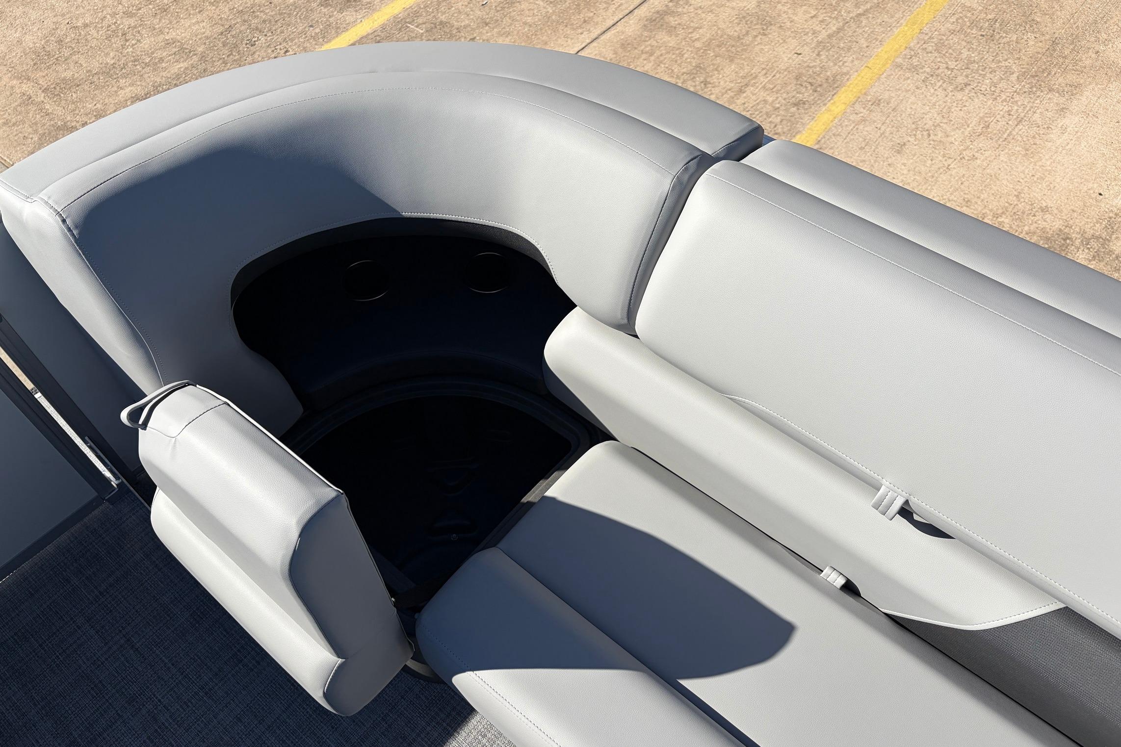 2026 Sun Tracker Party Barge 22 RF XP3, gray seating area with cup holders.