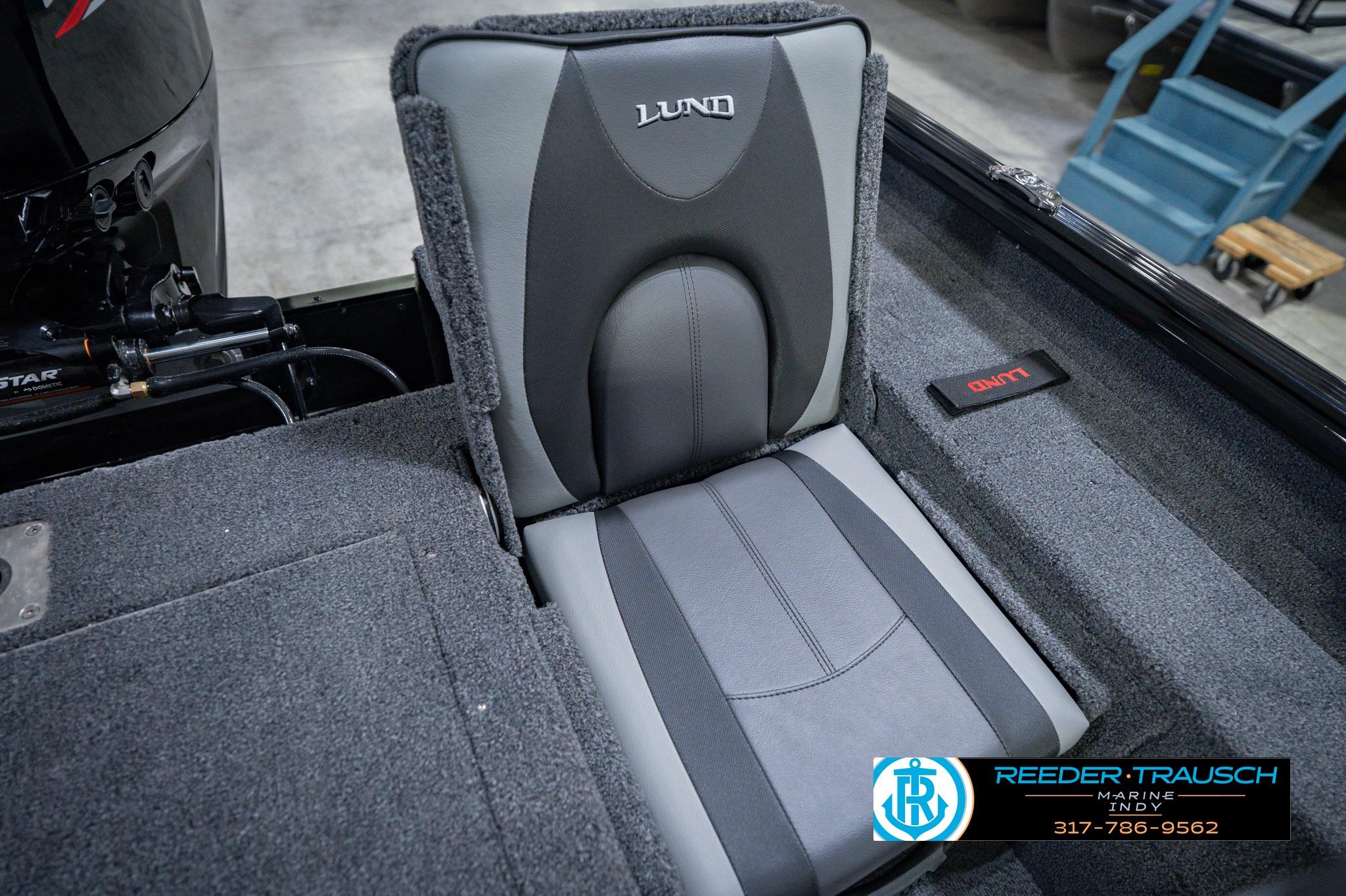 2026 Lund 1775 Impact XS boat seat with gray upholstery and branding details.