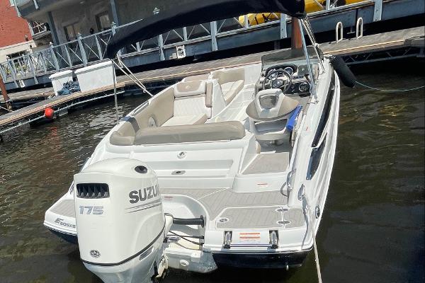 2020 Crownline E 205 XS boat with Suzuki 175 engine docked at marina.