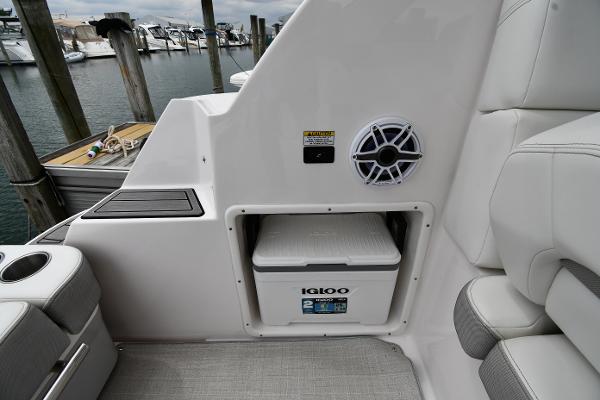 2021 Regal 35 Sport Coupe interior with Igloo cooler and speaker, docked at marina.