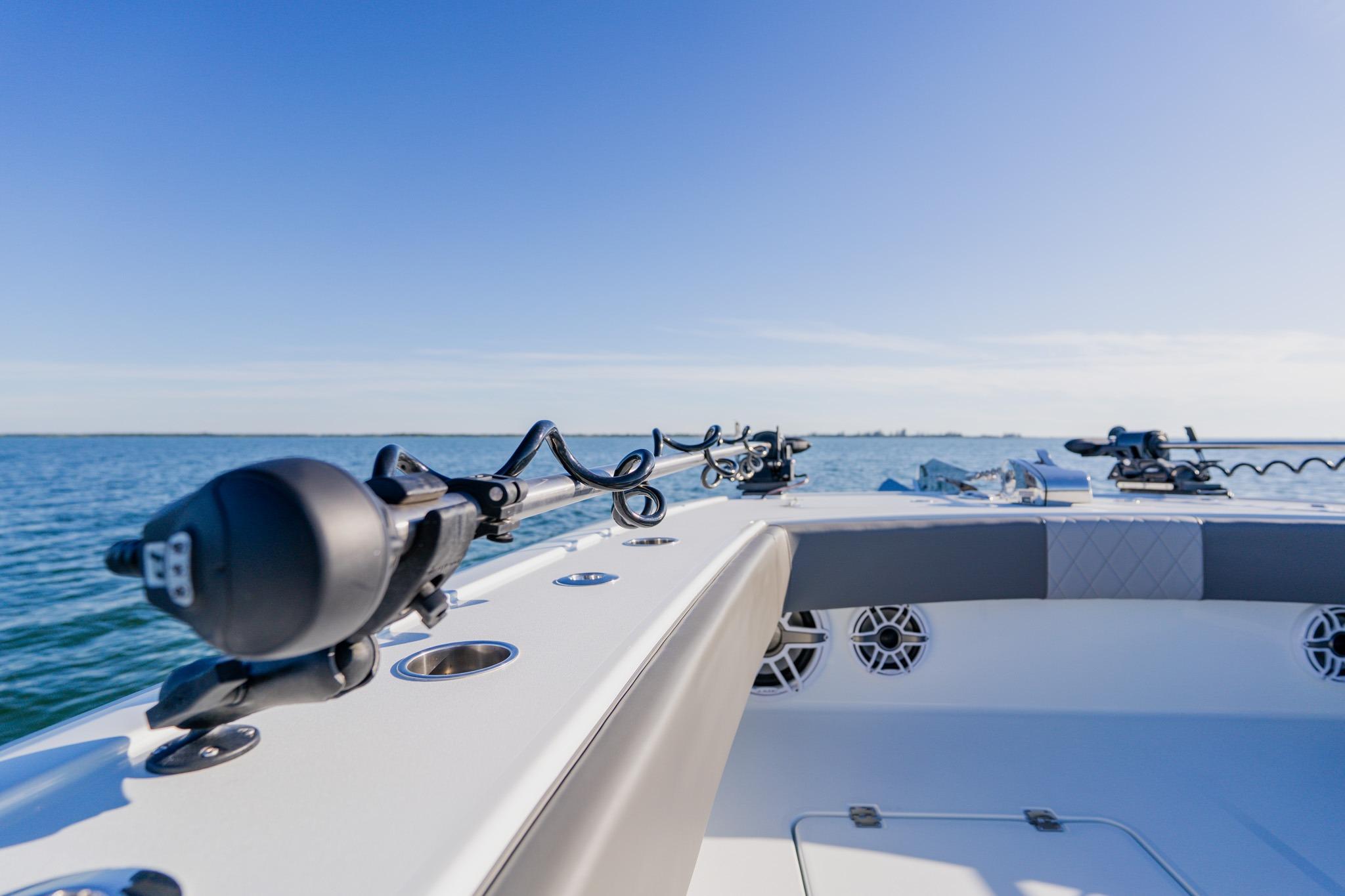 Freeman 42LR 2025 boat on open water, showcasing sleek design and fishing equipment.