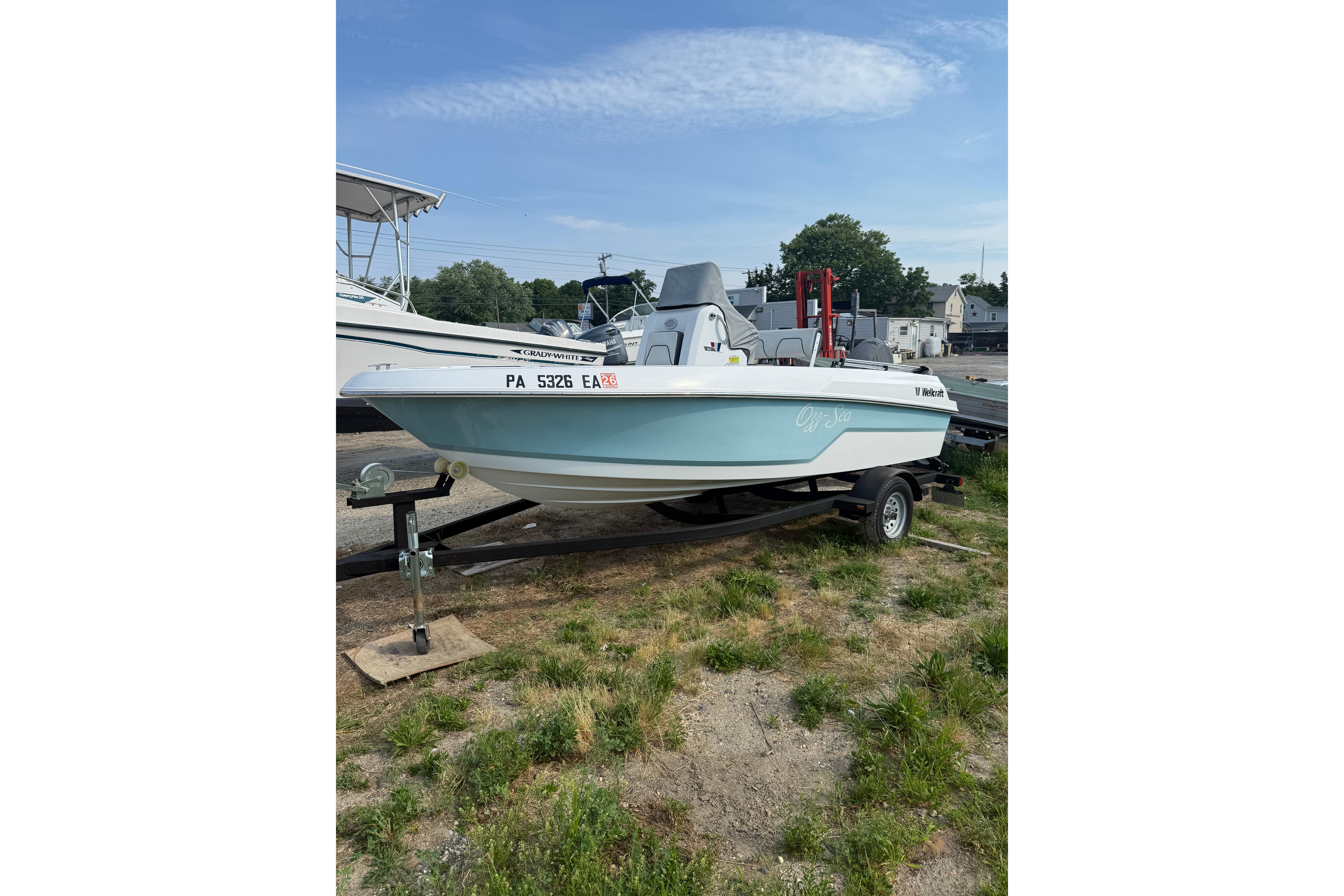 2020 Wellcraft 162 Fisherman boat on trailer, parked outdoors.