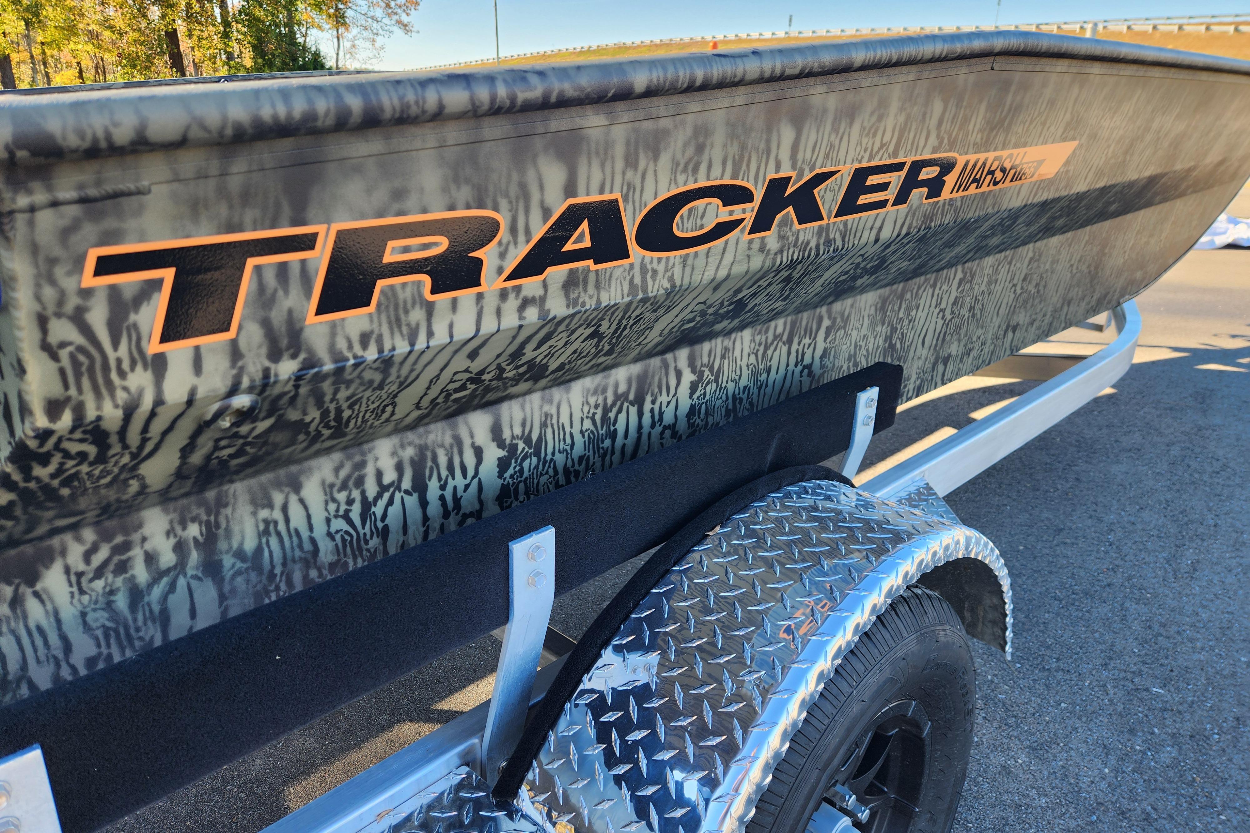 2026 Tracker Grizzly 1756 T Marsh boat with camouflage design on a trailer.