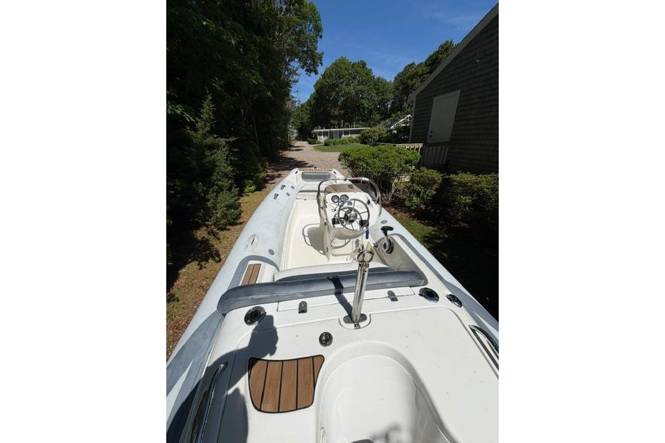 2016 Walker Bay Generation 450 DLX boat, white interior, parked outdoors.