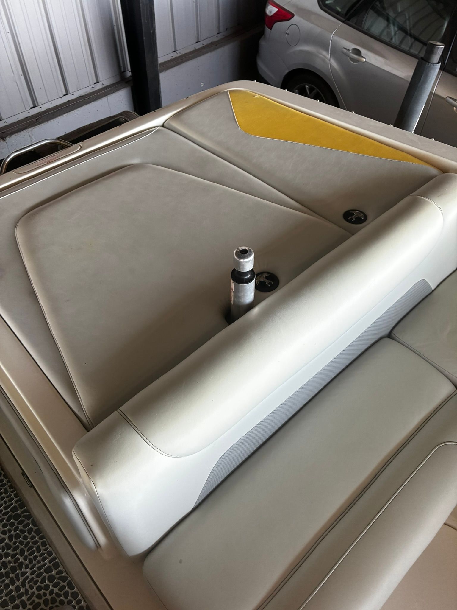 Rear view of a 2003 Centurion Avalanche boat in storage.