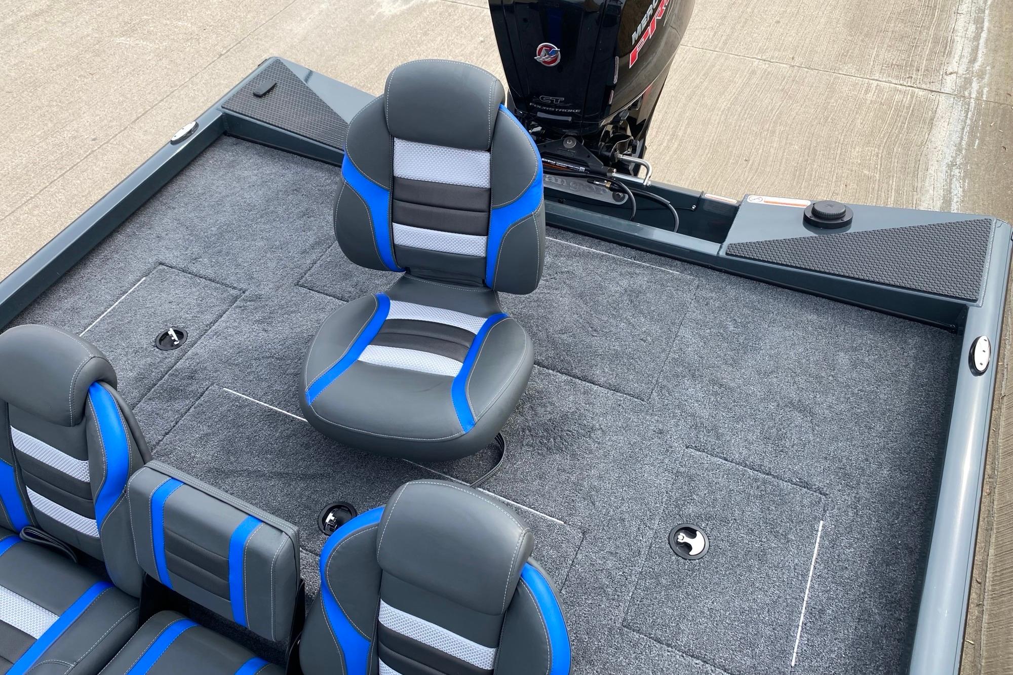 2026 Ranger RT188C boat interior with blue and gray seating on a carpeted deck.