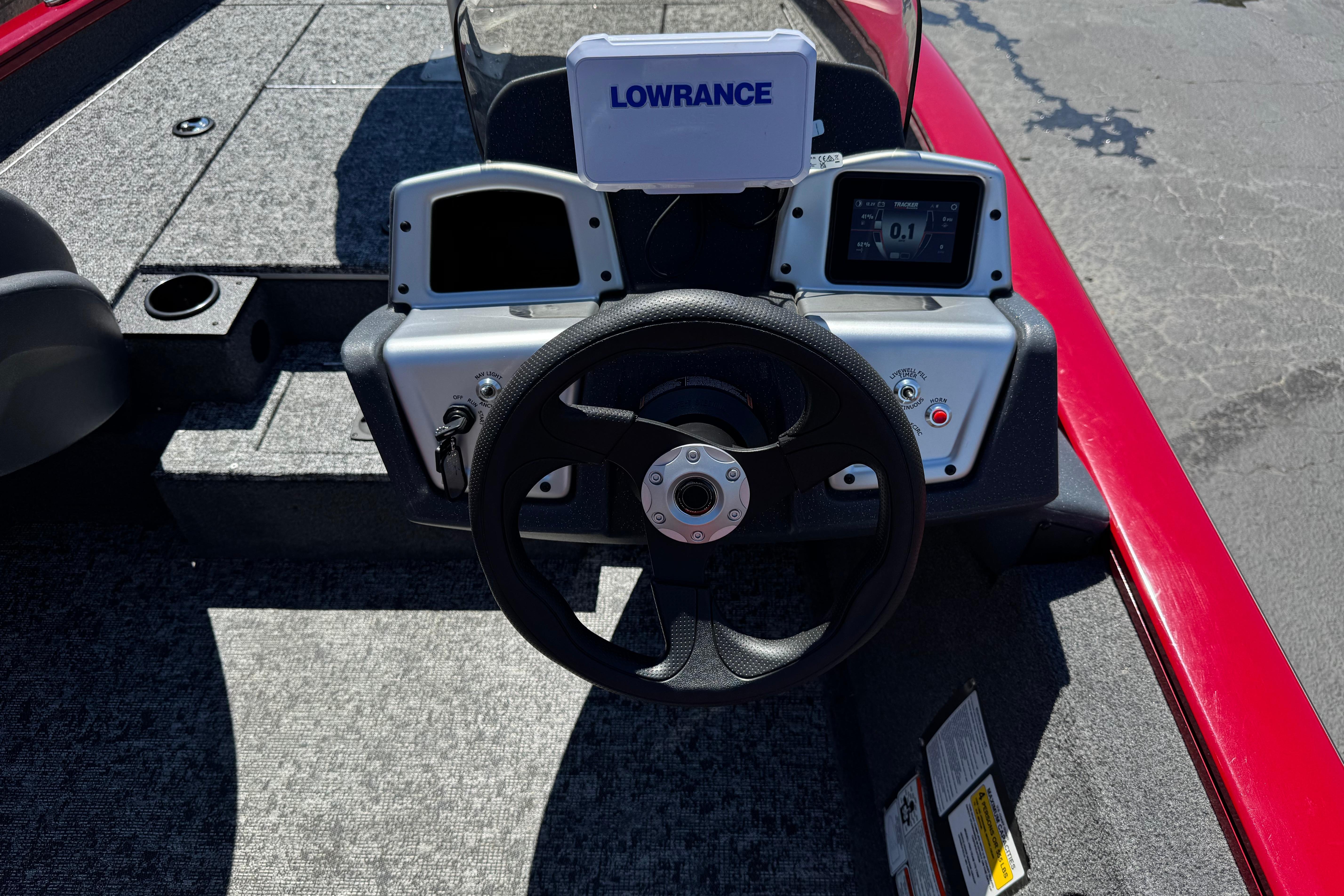 2025 Tracker Pro Team 175 TXW boat dashboard with Lowrance electronics and steering wheel.