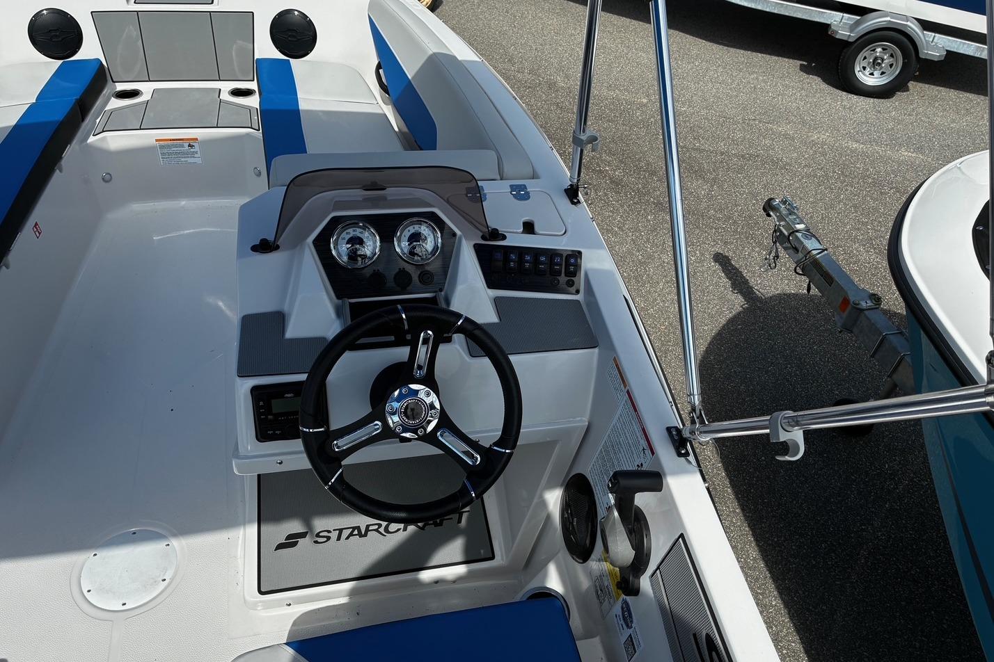 2026 Starcraft SV 16 OB boat interior with steering wheel and dashboard controls.