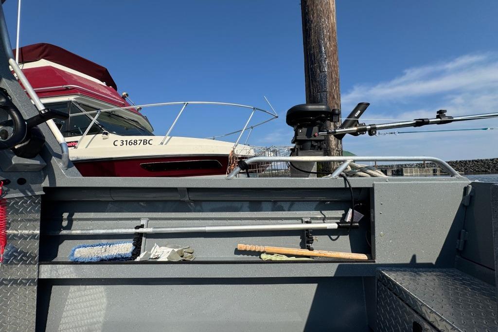 2023 Boulton VOYAGER PRO boat with fishing gear and docked vessel in background.