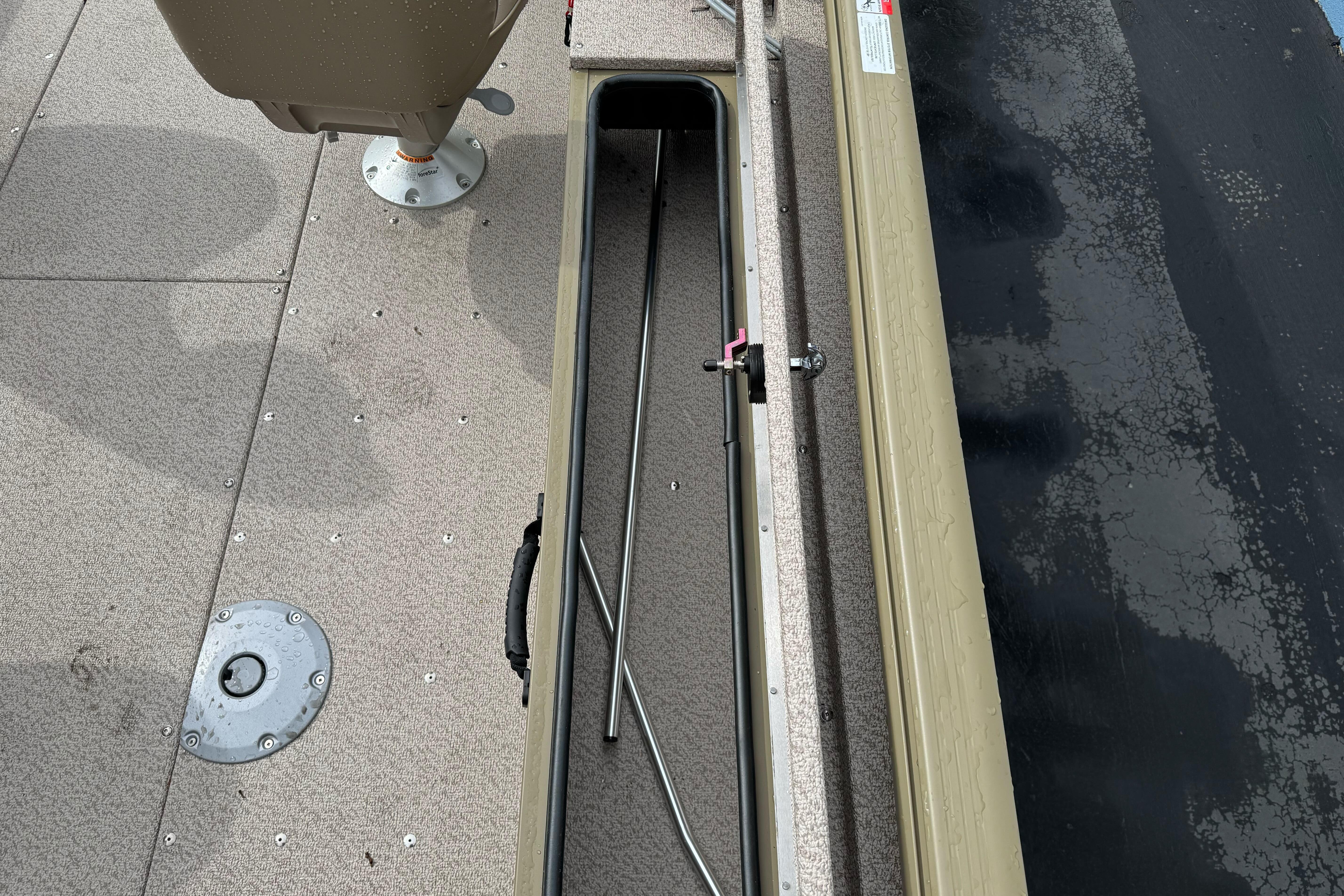 2026 Lund 2075 Alaskan SS boat interior with rod storage compartment.